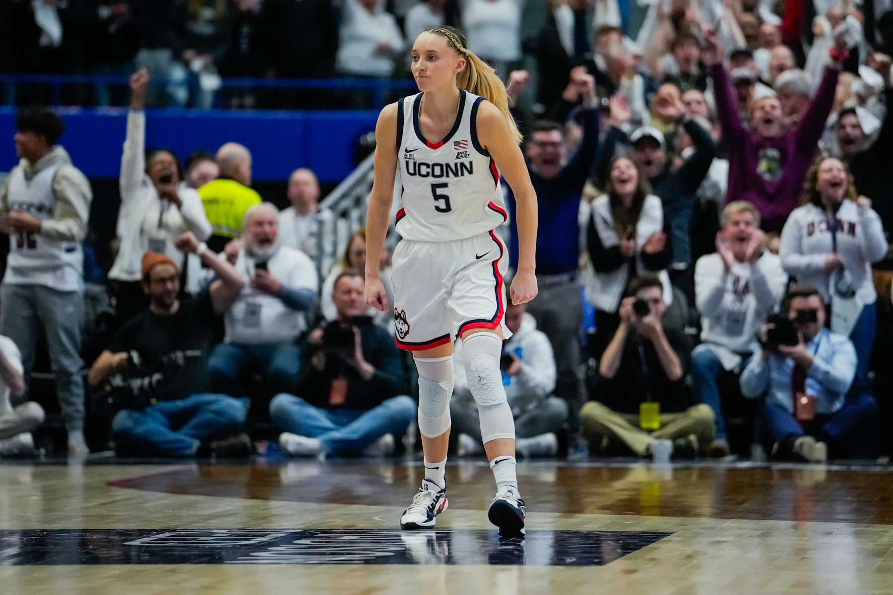 HARTFORD, CONNECTICUT - DECEMBER 21: Paige Bueckers #5 of the Connecticut Huskies reacts during the second half of an NCAA women's basketball game against the USC Trojans at the XL Center on December 21, 2024 in Hartford, Connecticut. (Photo by Joe Buglewicz/Getty Images)