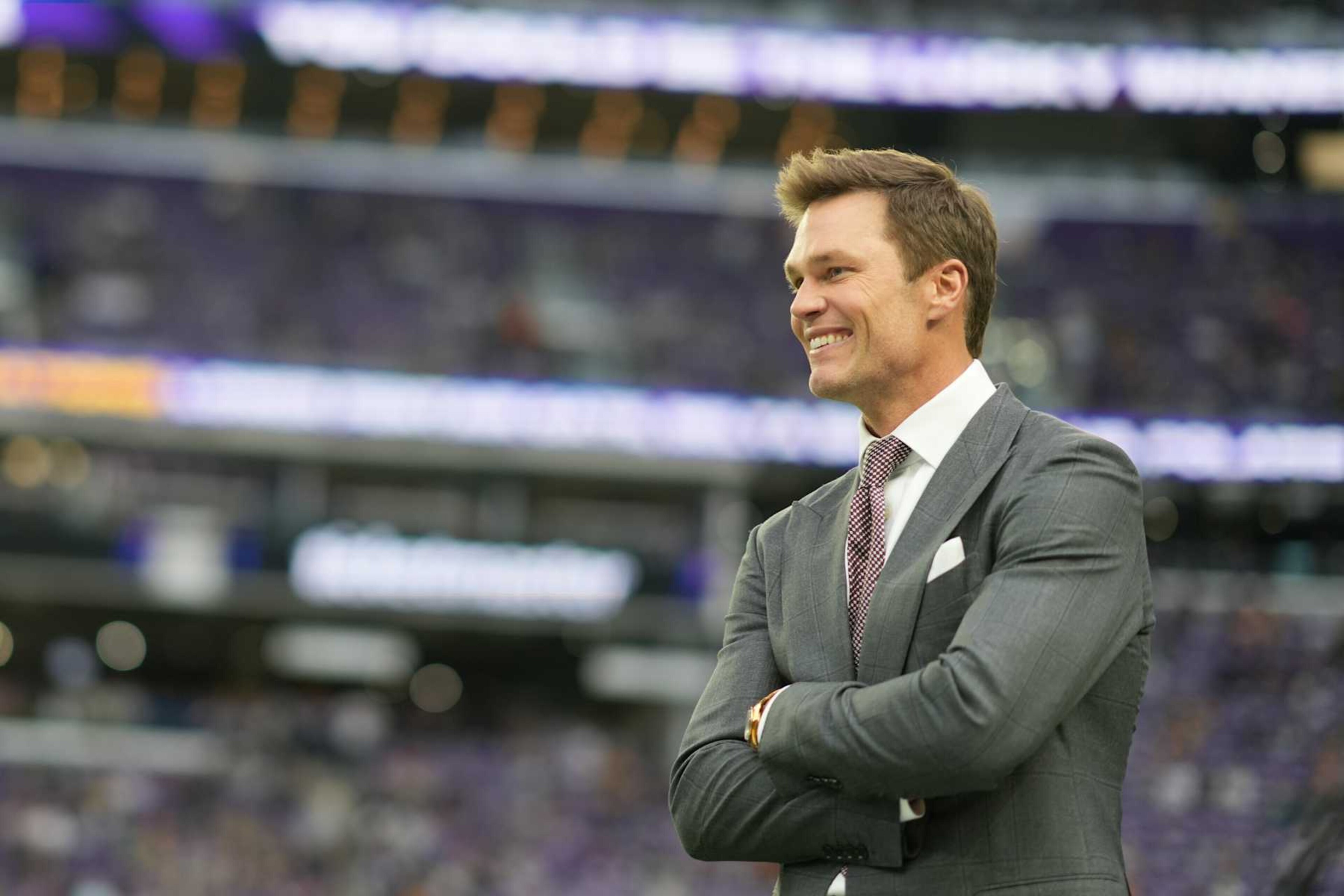 MINNEAPOLIS, MINNESOTA - DECEMBER 29: Former NFL player Tom Brady looks on prior to a game between the Green Bay Packers and the Minnesota Vikings at U.S. Bank Stadium on December 29, 2024 in Minneapolis, Minnesota. (Photo by Brace Hemmelgarn/Getty Images) MINNEAPOLIS, MINNESOTA - DECEMBER 29: Former NFL player Tom Brady looks on prior to a game between the Green Bay Packers and the Minnesota Vikings at U.S. Bank Stadium on December 29, 2024 in Minneapolis, Minnesota. (Photo by Brace Hemmelgarn/Getty Images)