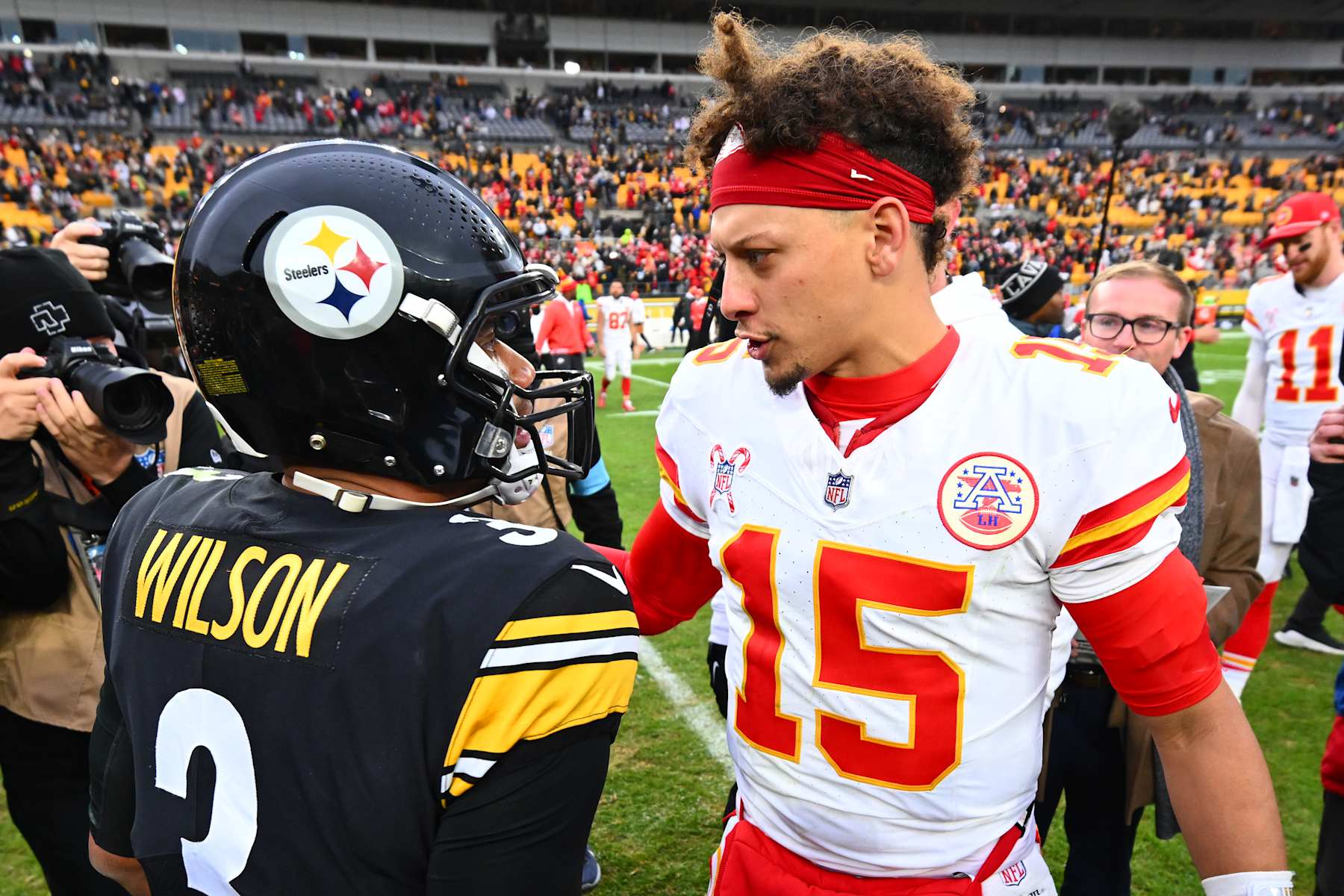 PITTSBURGH, PENNSYLVANIA - DECEMBER 25: Russell Wilson #3 of the Pittsburgh Steelers and Patrick Mahomes #15 of the Kansas City Chiefs embrace after the game at Acrisure Stadium on December 25, 2024 in Pittsburgh, Pennsylvania. (Photo by Joe Sargent/Getty Images)
