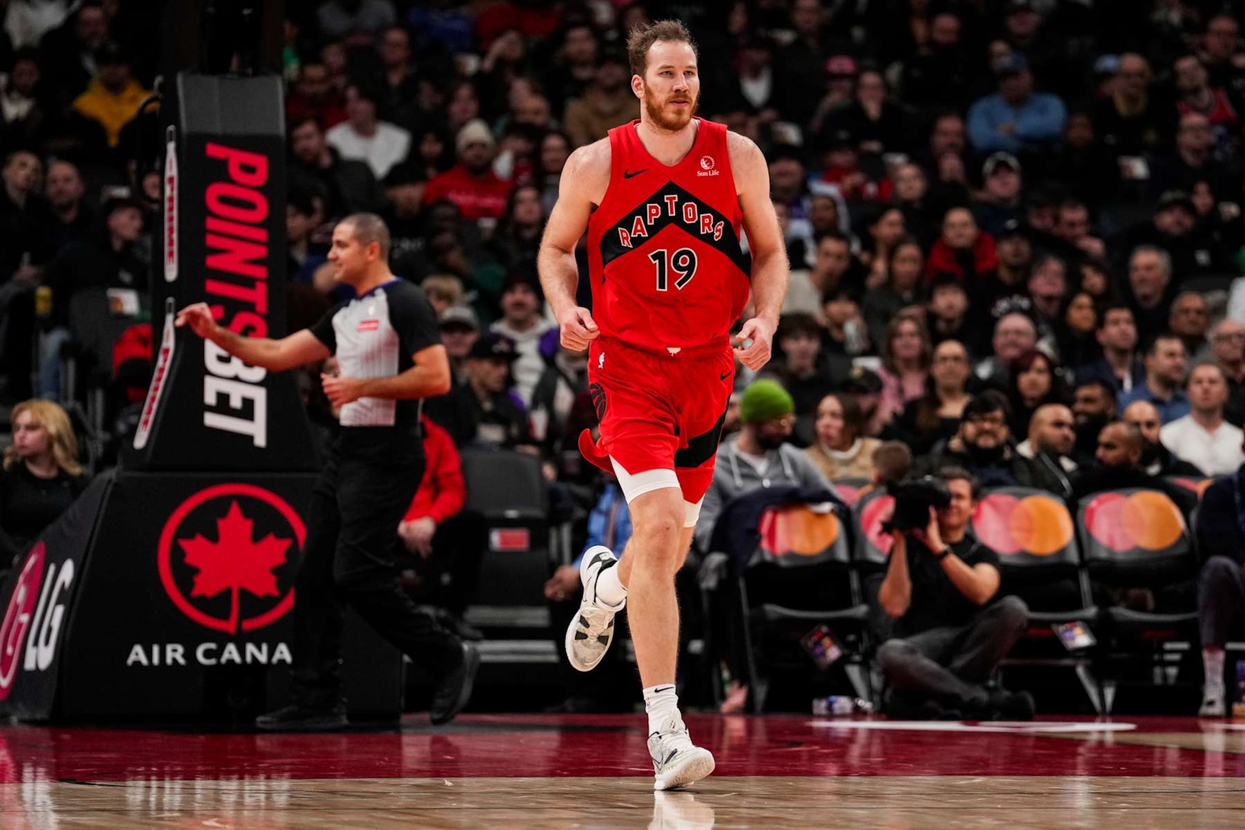 TORONTO, ON - DECEMBER 1: Jakob Poeltl #19 of the Toronto Raptors runs up the court against the Miami Heat at Scotiabank Arena on December 1, 2024 in Toronto, Ontario, Canada. NOTE TO USER: User expressly acknowledges and agrees that, by downloading and/or using this Photograph, user is consenting to the terms and conditions of the Getty Images License Agreement. (Photo by Andrew Lahodynskyj/Getty Images) TORONTO, ON - DECEMBER 1: Jakob Poeltl #19 of the Toronto Raptors runs up the court against the Miami Heat at Scotiabank Arena on December 1, 2024 in Toronto, Ontario, Canada. NOTE TO USER: User expressly acknowledges and agrees that, by downloading and/or using this Photograph, user is consenting to the terms and conditions of the Getty Images License Agreement. (Photo by Andrew Lahodynskyj/Getty Images)