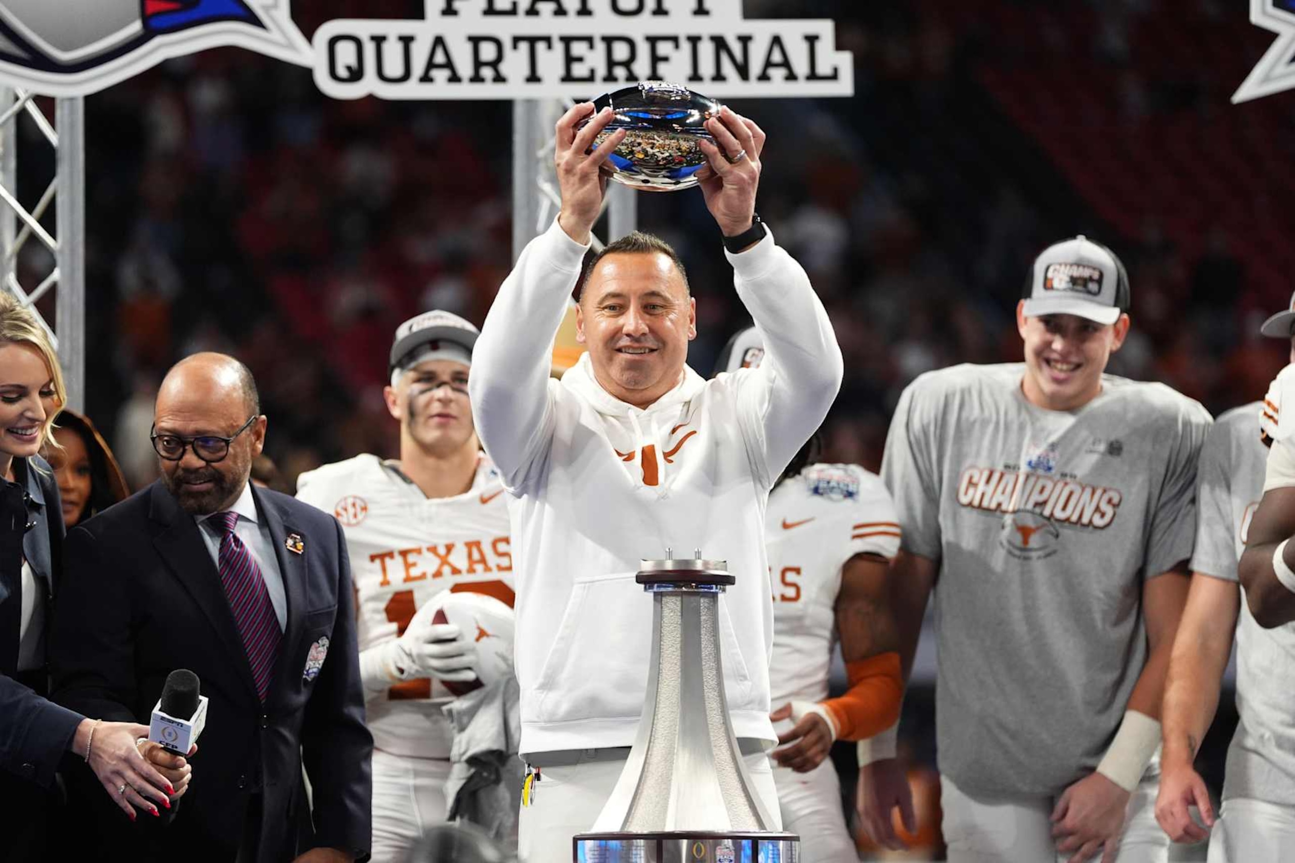 ATLANTA, GEORGIA - JANUARY 1: Head coach Steve Sarkisian of the Texas Longhorns lifts the trophy to celebrate after defeating the Arizona State Sun Devils at Mercedes-Benz Stadium on January 1, 2025 in Atlanta, Georgia. (Photo by CFP/Getty Images)