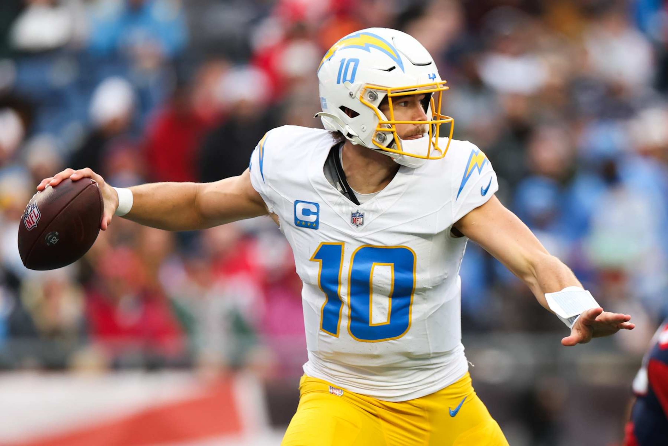 FOXBOROUGH, MASSACHUSETTS - DECEMBER 28: Justin Herbert #10 of the Los Angeles Chargers looks to throw the football during the third quarter against the New England Patriots at Gillette Stadium on December 28, 2024 in Foxborough, Massachusetts. (Photo by Kathryn Riley/Getty Images) FOXBOROUGH, MASSACHUSETTS - DECEMBER 28: Justin Herbert #10 of the Los Angeles Chargers looks to throw the football during the third quarter against the New England Patriots at Gillette Stadium on December 28, 2024 in Foxborough, Massachusetts. (Photo by Kathryn Riley/Getty Images)