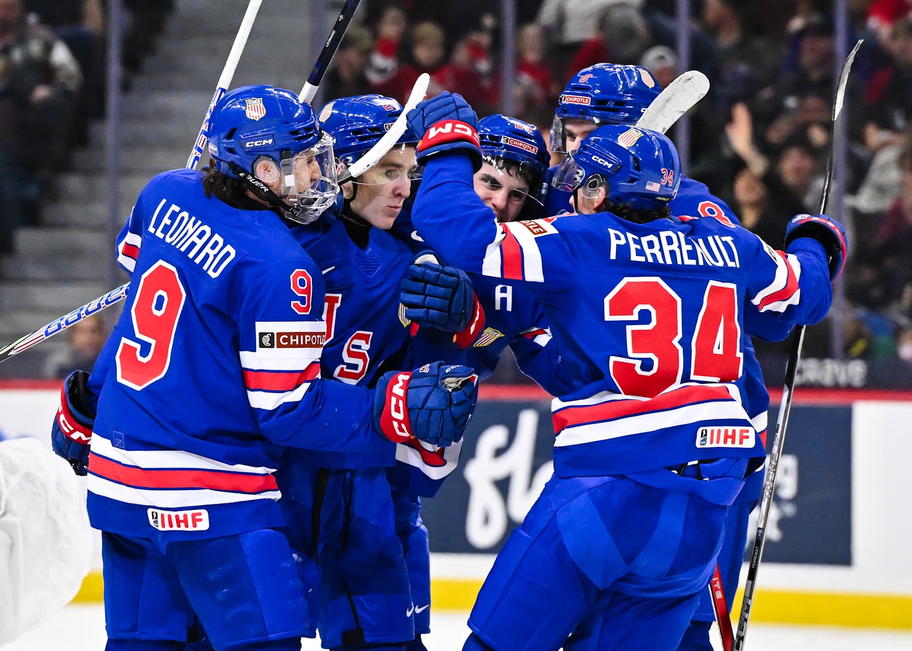 OTTAWA, CANADA - JANUARY 05:  Cole Hutson #24 of Team USA celebrates his goal with teammates Ryan Leonard #9, Brandon Svoboda #8, Zeev Buium #28 and Gabe Perreault #34 in the second period against Team Finland of the gold medal game during the 2025 IIHF World Junior Championship at Canadian Tire Centre on January 5, 2025 in Ottawa, Ontario, Canada.  (Photo by Minas Panagiotakis/Getty Images)