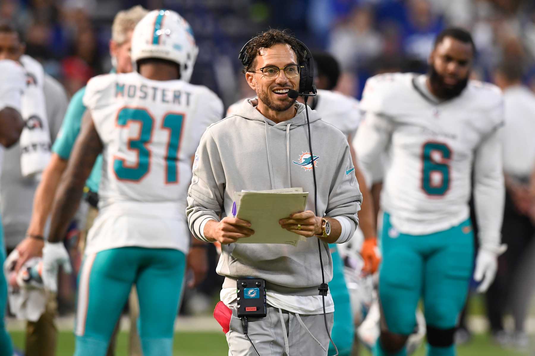 INDIANAPOLIS, IN - OCTOBER 20: Miami Dolphins Head Coach Mike McDaniel communicates on his headset during the NFL game between the Miami Dolphins and the Indianapolis Colts on October 20, 2024, at Lucas Oil Stadium in Indianapolis, Indiana.(Photo by Michael Allio/Icon Sportswire via Getty Images)