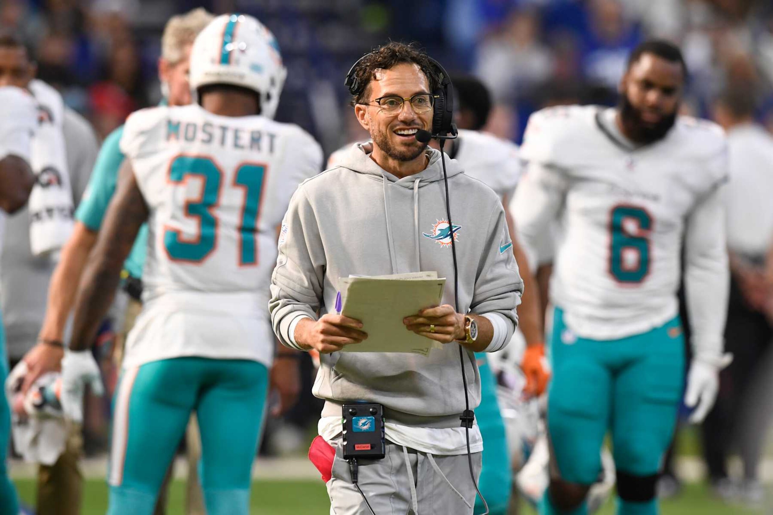 INDIANAPOLIS, IN - OCTOBER 20: Miami Dolphins Head Coach Mike McDaniel communicates on his headset during the NFL game between the Miami Dolphins and the Indianapolis Colts on October 20, 2024, at Lucas Oil Stadium in Indianapolis, Indiana.(Photo by Michael Allio/Icon Sportswire via Getty Images)