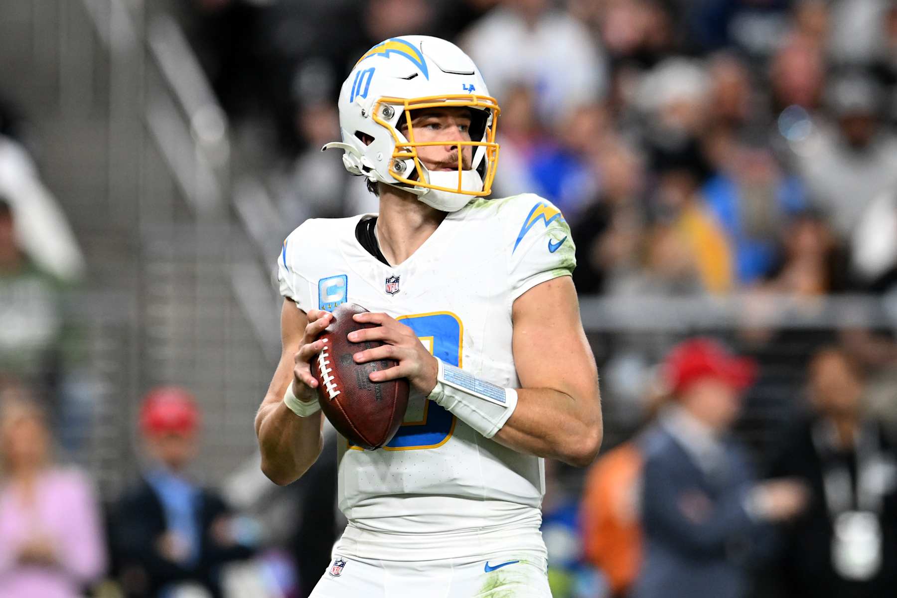 LAS VEGAS, NEVADA - JANUARY 05: Justin Herbert #10 of the Los Angeles Chargers looks to pass the ball against the Las Vegas Raiders during the third quarter at Allegiant Stadium on January 05, 2025 in Las Vegas, Nevada. (Photo by Candice Ward/Getty Images)