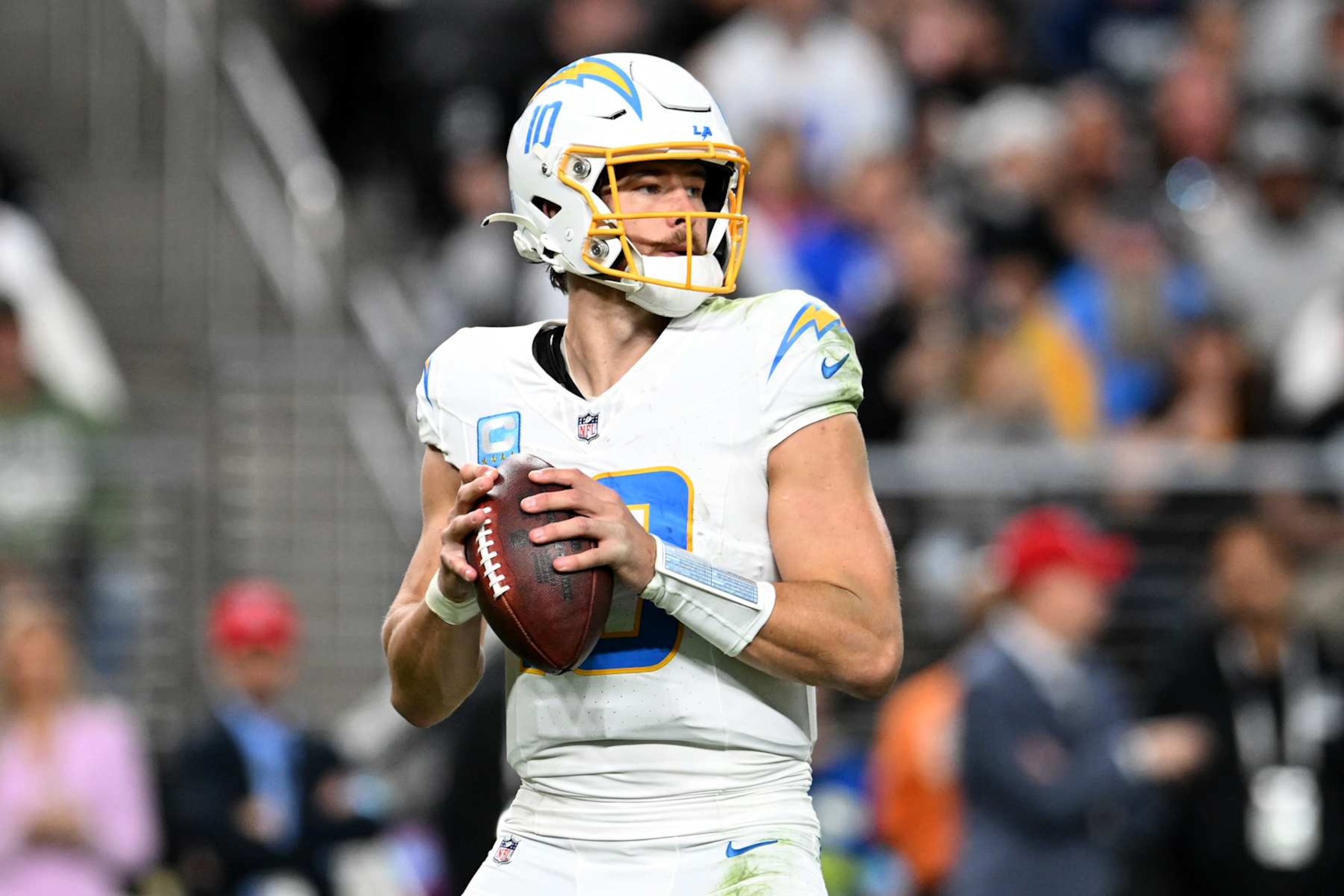 LAS VEGAS, NEVADA - JANUARY 05: Justin Herbert #10 of the Los Angeles Chargers looks to pass the ball against the Las Vegas Raiders during the third quarter at Allegiant Stadium on January 05, 2025 in Las Vegas, Nevada. (Photo by Candice Ward/Getty Images) LAS VEGAS, NEVADA - JANUARY 05: Justin Herbert #10 of the Los Angeles Chargers looks to pass the ball against the Las Vegas Raiders during the third quarter at Allegiant Stadium on January 05, 2025 in Las Vegas, Nevada. (Photo by Candice Ward/Getty Images)