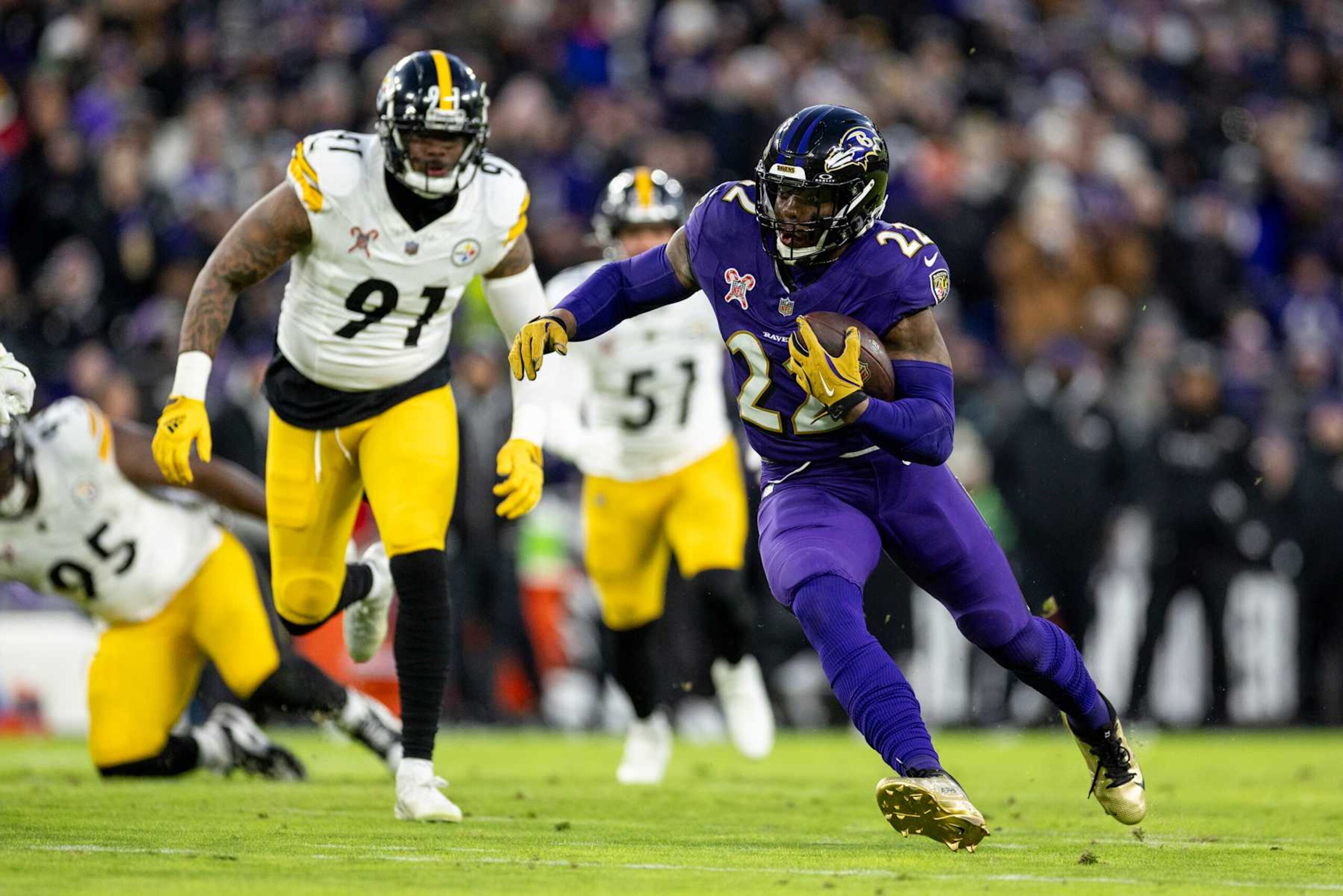 BALTIMORE, MARYLAND - DECEMBER 21: Derrick Henry #22 of the Baltimore Ravens runs with the ball during an NFL Football game against the Pittsburgh Steelers at M&T Bank Stadium on December 21, 2024 in Baltimore, Maryland. (Photo by Michael Owens/Getty Images)