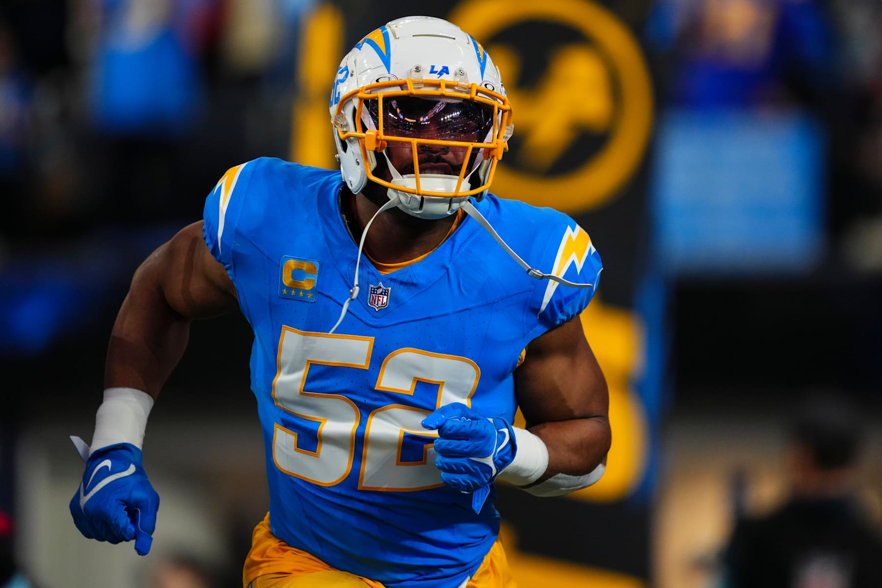 INGLEWOOD, CA - DECEMBER 19: Khalil Mack #52 of the Los Angeles Chargers runs out of the tunnel prior to an NFL football game against the Denver Broncos at SoFi Stadium on December 19, 2024 in Inglewood, California. (Photo by Cooper Neill/Getty Images)