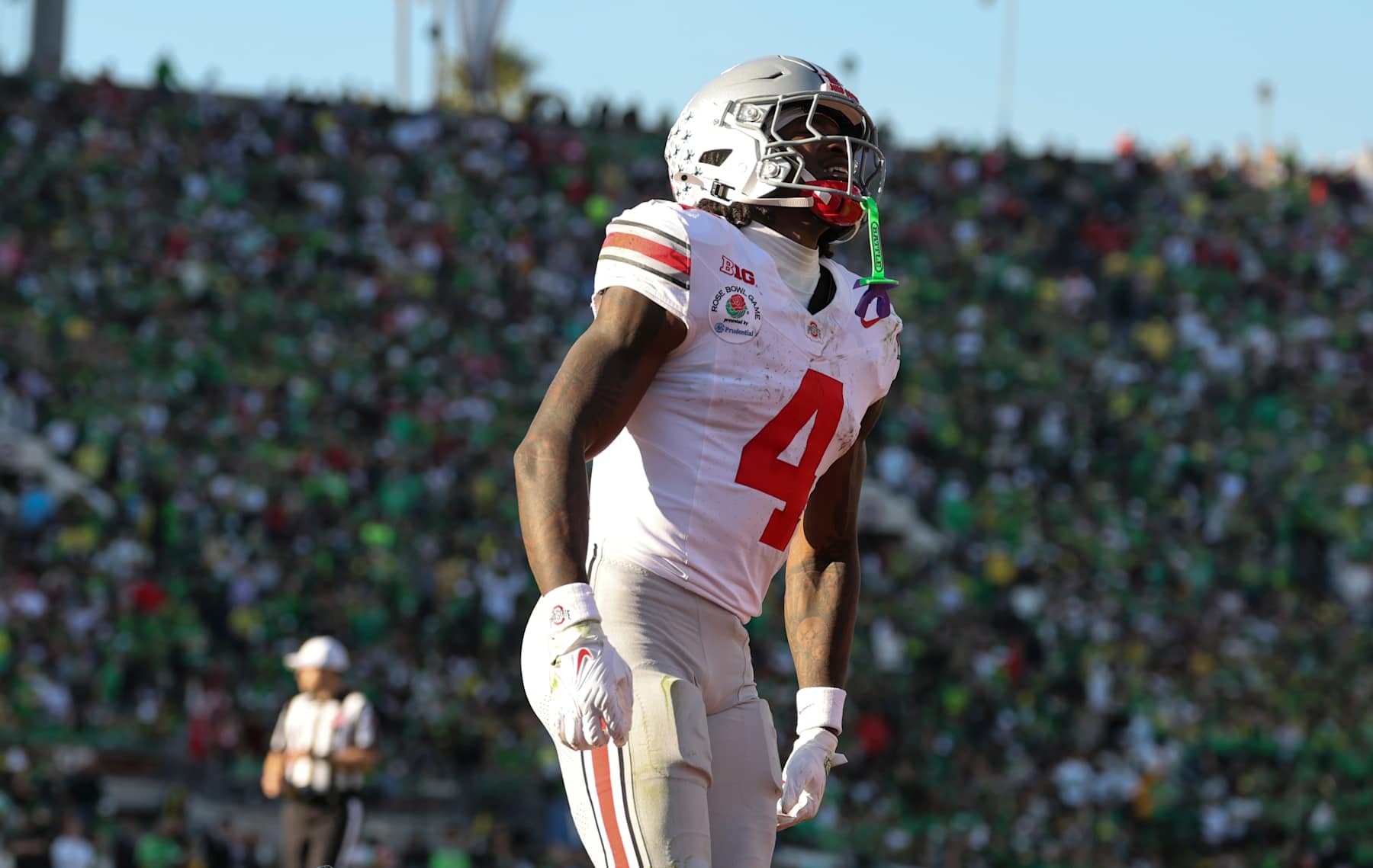PASADENA, CALIFORNIA - JANUARY 1:  Jeremiah Smith #4 of the Ohio State Buckeyes reacts after scoring a touchdown during the first half against the Oregon Ducks at Rose Bowl Stadium on January 1, 2025 in Pasadena, California. (Photo by CFP/Getty Images)