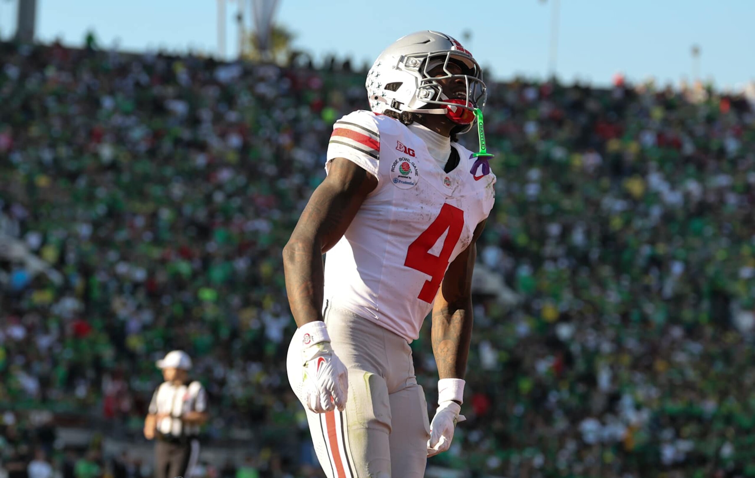 PASADENA, CALIFORNIA - JANUARY 1:  Jeremiah Smith #4 of the Ohio State Buckeyes reacts after scoring a touchdown during the first half against the Oregon Ducks at Rose Bowl Stadium on January 1, 2025 in Pasadena, California. (Photo by CFP/Getty Images)