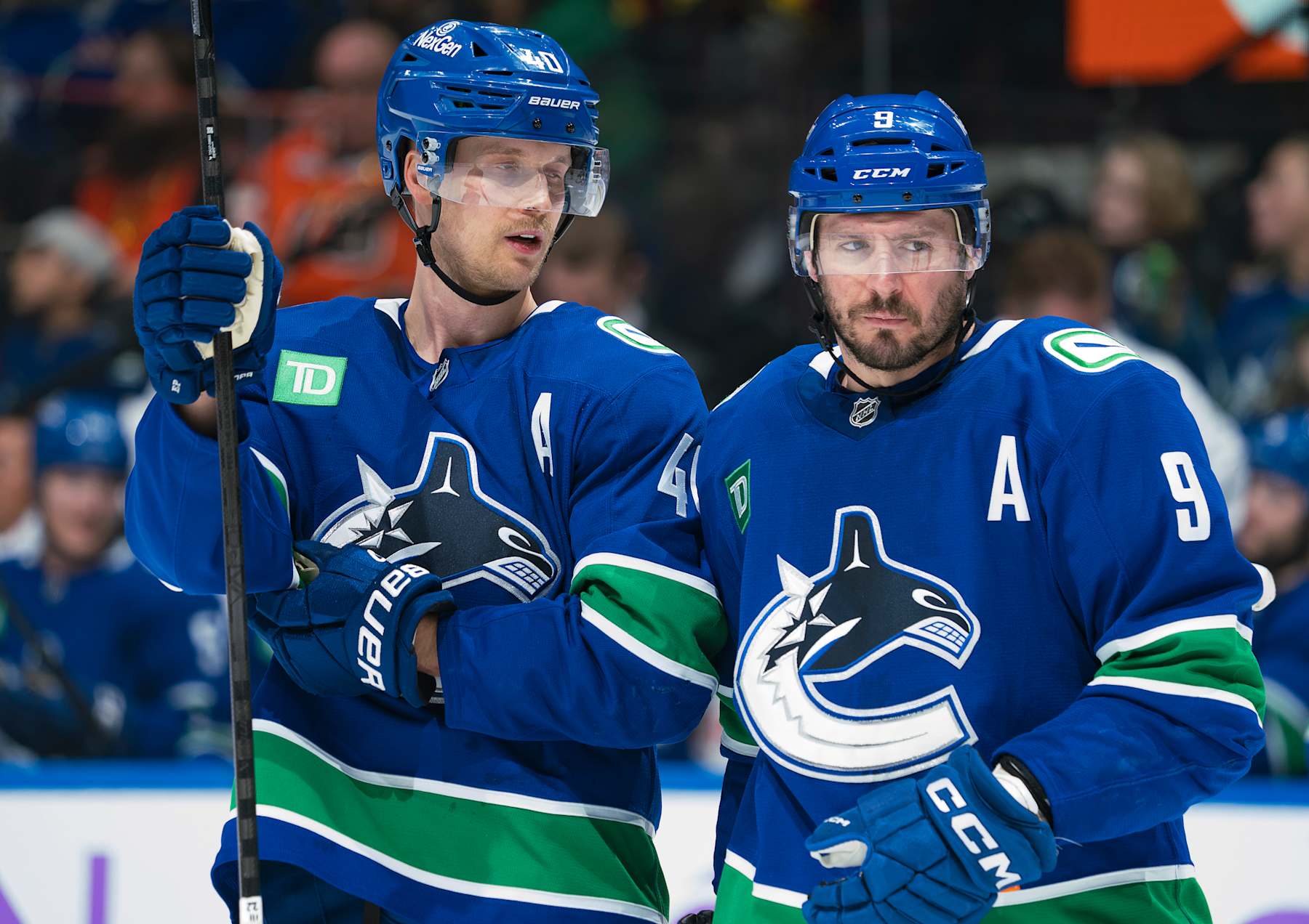 Vancouver Canucks forwards Elias Pettersson (left) and J.T. Miller. 