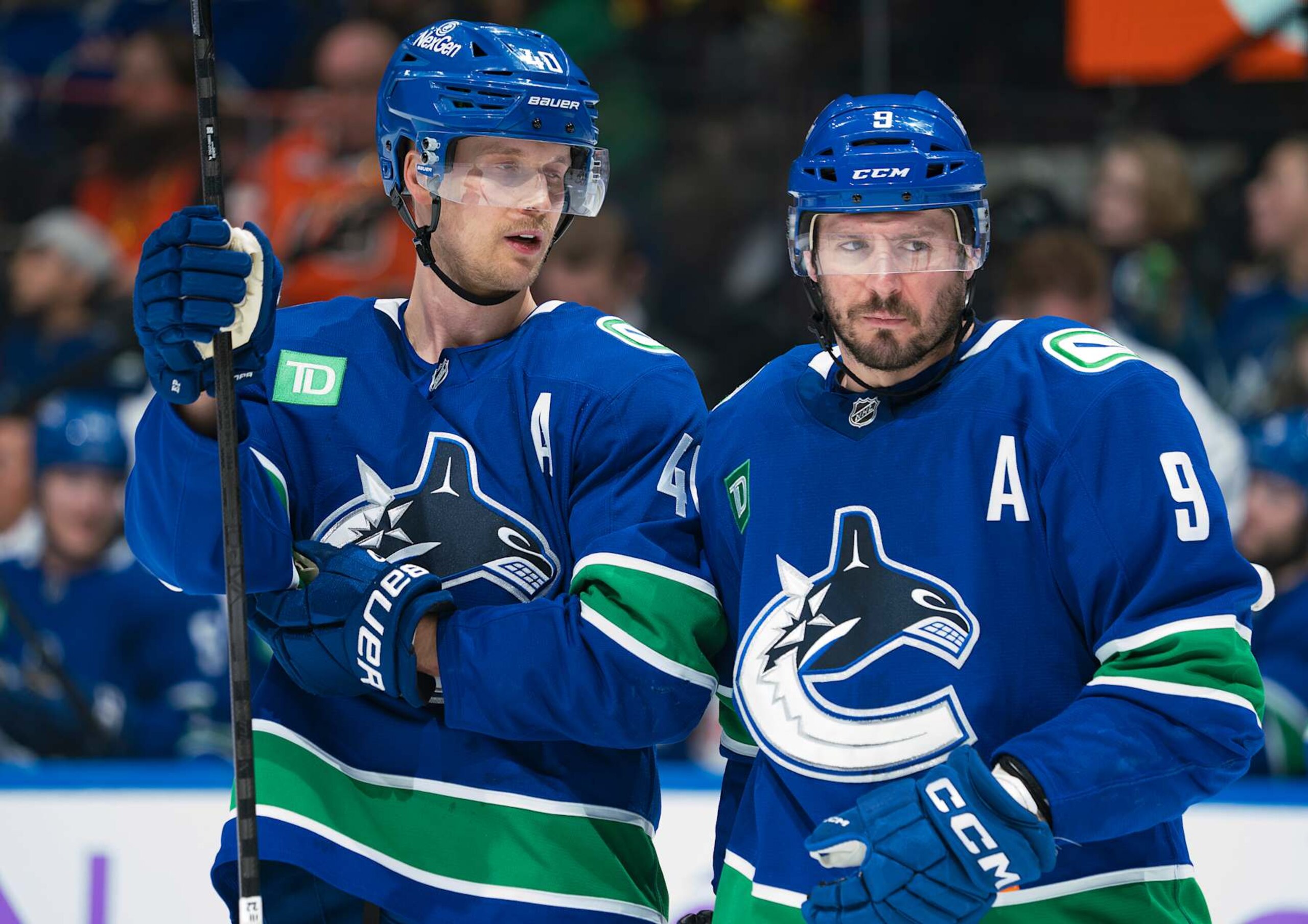 Vancouver Canucks forwards Elias Pettersson (left) and J.T. Miller. 