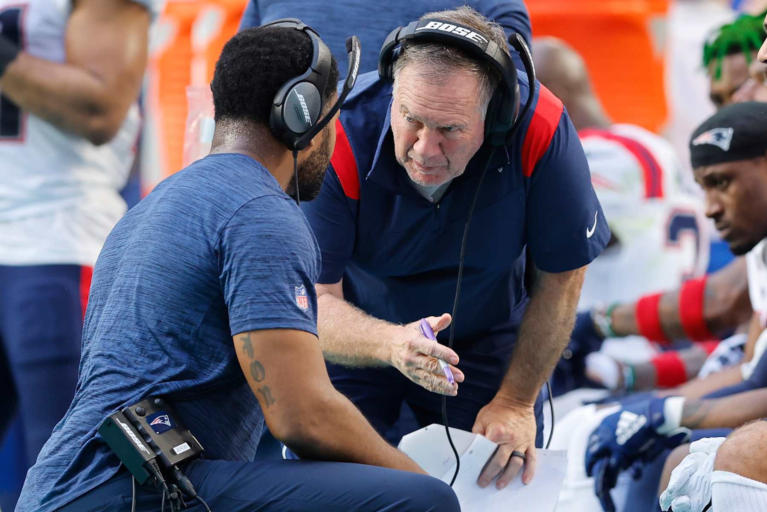 MIAMI GARDENS, FLORIDA - JANUARY 09: Head coach Bill Belichick and outside linebackers coach Jerod Mayo of the New England Patriots talk against the Miami Dolphins during the fourth quarter at Hard Rock Stadium on January 09, 2022 in Miami Gardens, Florida. (Photo by Michael Reaves/Getty Images) MIAMI GARDENS, FLORIDA - JANUARY 09: Head coach Bill Belichick and outside linebackers coach Jerod Mayo of the New England Patriots talk against the Miami Dolphins during the fourth quarter at Hard Rock Stadium on January 09, 2022 in Miami Gardens, Florida. (Photo by Michael Reaves/Getty Images)