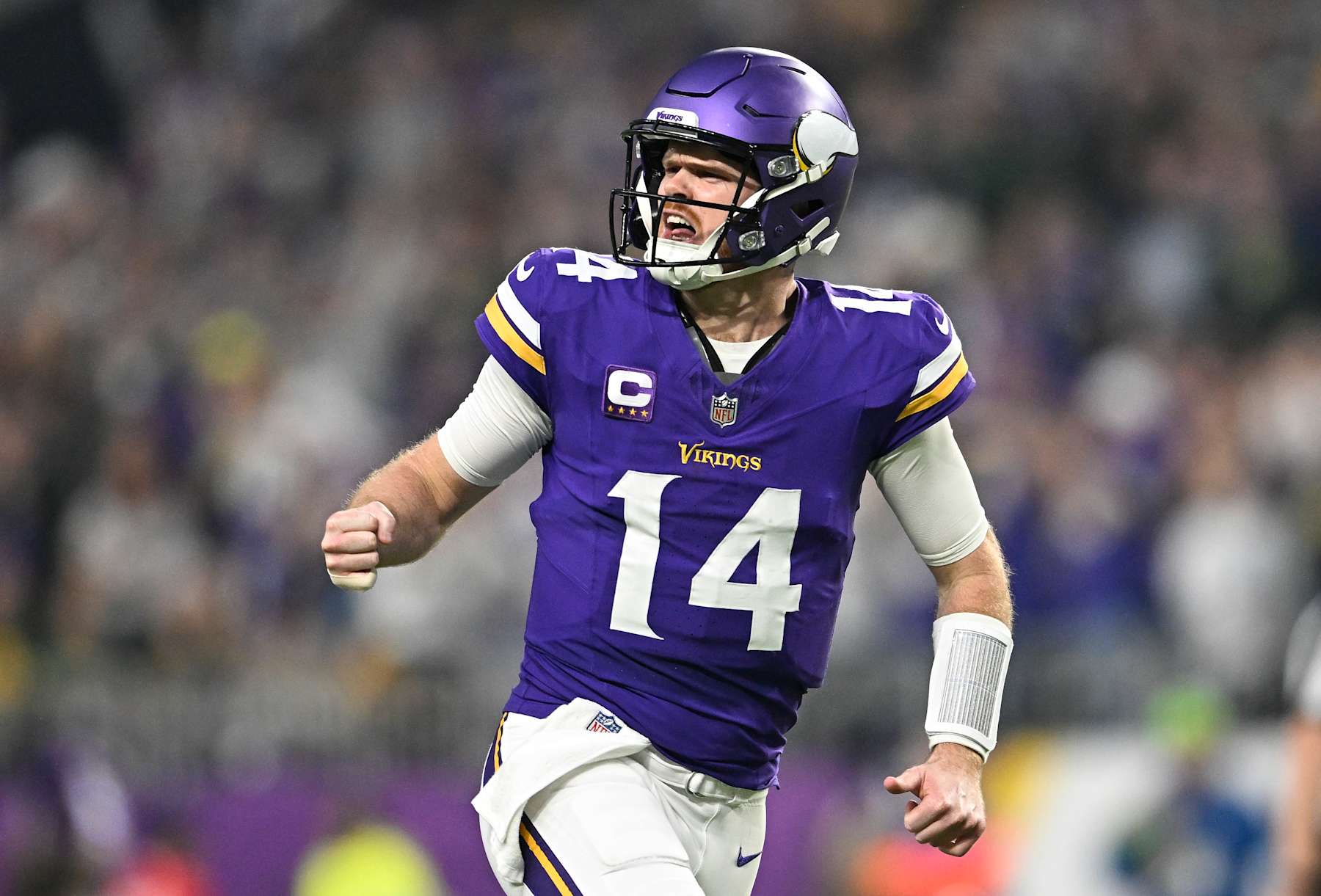 MINNEAPOLIS, MINNESOTA - DECEMBER 29: Quarterback Sam Darnold #14 of the Minnesota Vikings reacts after a throwing a touchdown pass during the second quarter against the Green Bay Packers at U.S. Bank Stadium on December 29, 2024 in Minneapolis, Minnesota. (Photo by Stephen Maturen/Getty Images)