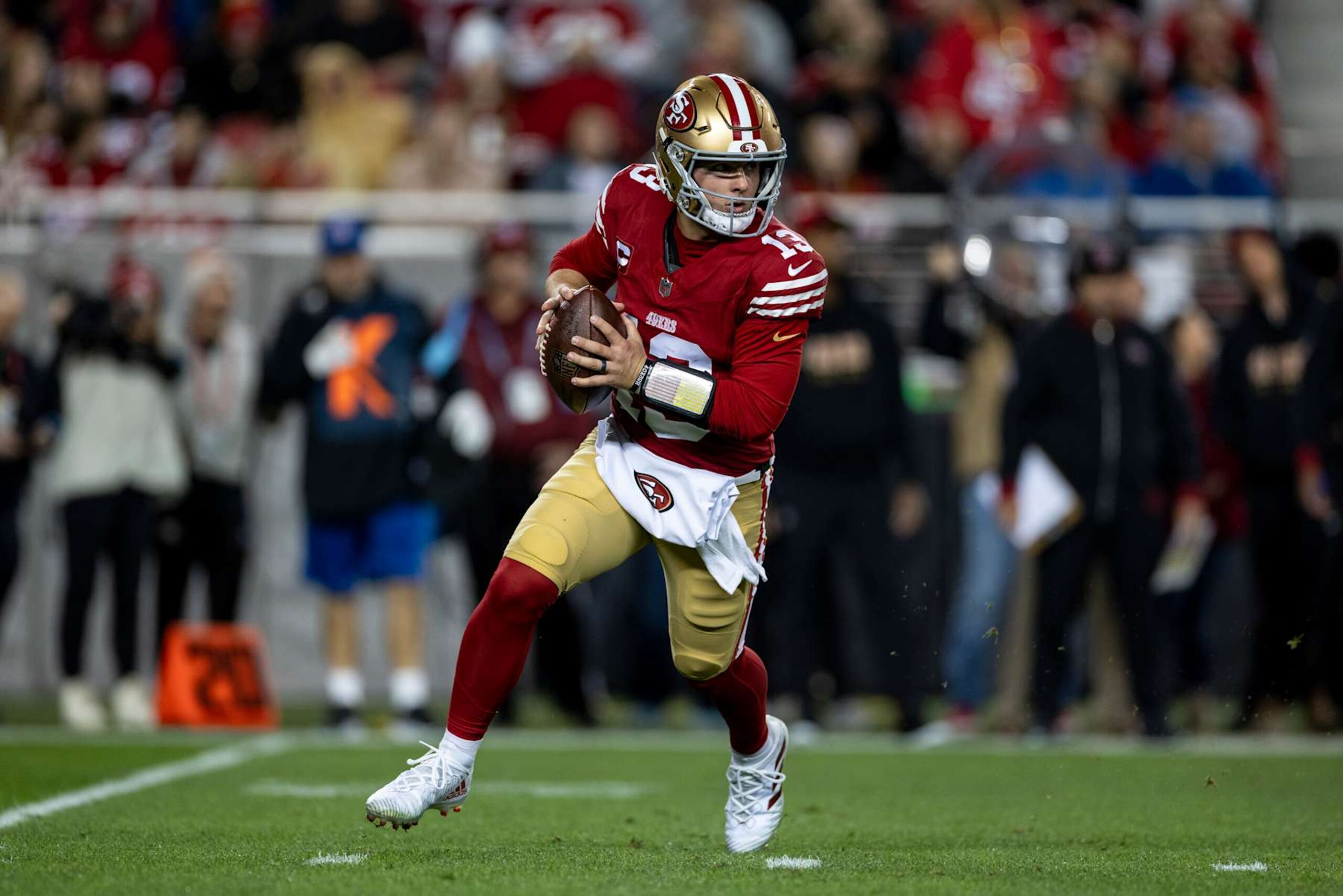 SANTA CLARA, CALIFORNIA - DECEMBER 30: Brock Purdy #13 of the San Francisco 49ers scrambles and looks to pass during an NFL Football game against the Detroit Lions at Levi's Stadium on December 30, 2024 in Santa Clara, California. (Photo by Michael Owens/Getty Images) SANTA CLARA, CALIFORNIA - DECEMBER 30: Brock Purdy #13 of the San Francisco 49ers scrambles and looks to pass during an NFL Football game against the Detroit Lions at Levi's Stadium on December 30, 2024 in Santa Clara, California. (Photo by Michael Owens/Getty Images)