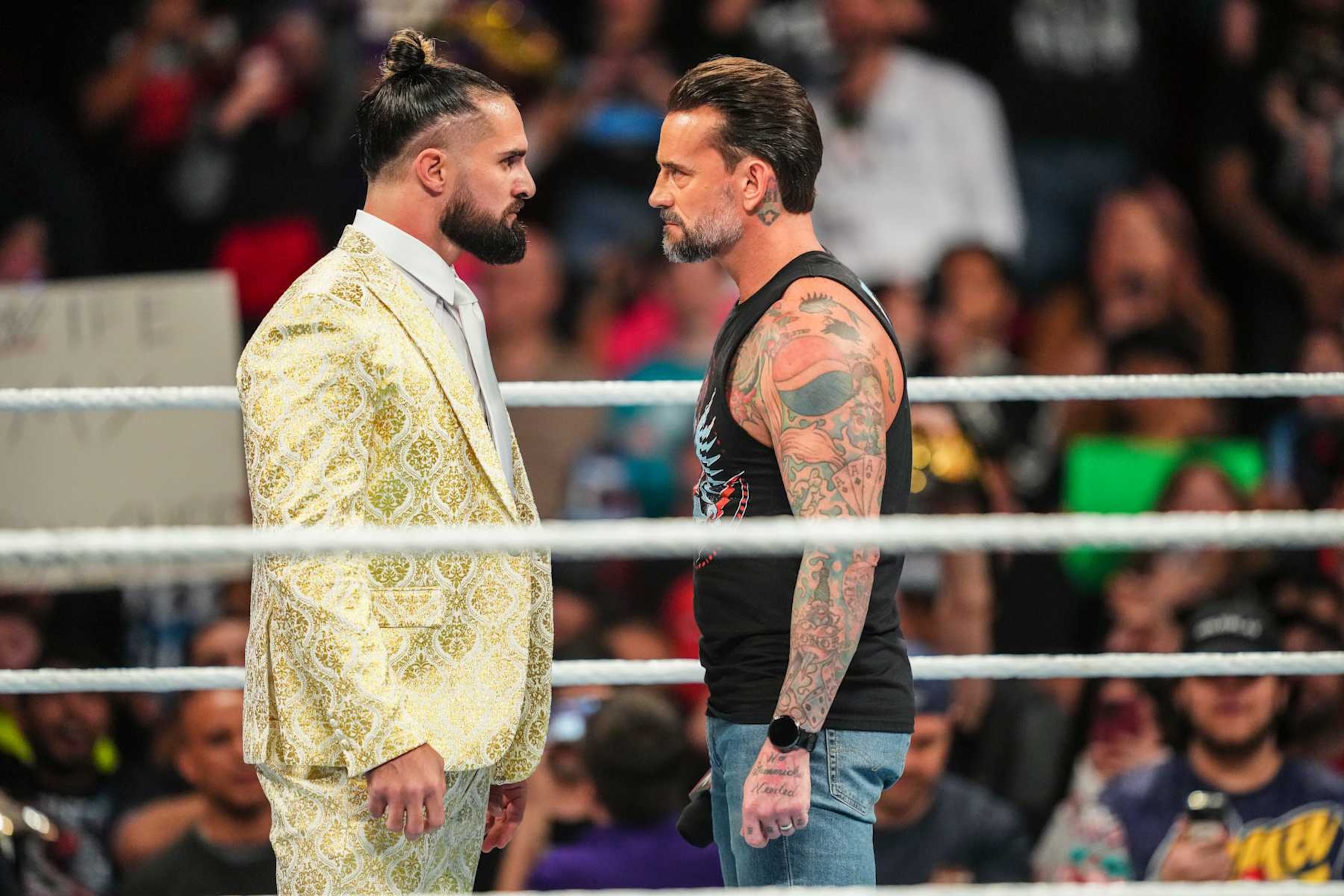 HOUSTON, TEXAS - DECEMBER 30: Seth Rollins and CM Punk face off during Monday Night RAW at Toyota Center on December 30, 2024 in Houston, Texas.  (Photo by WWE/Getty Images)