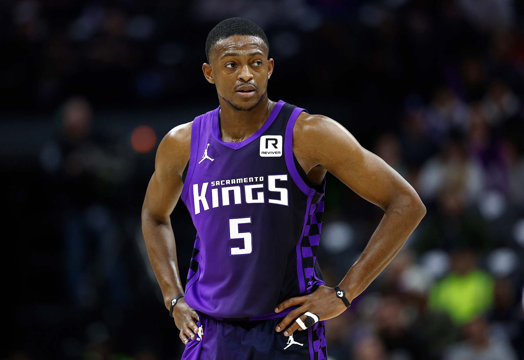 SACRAMENTO, CALIFORNIA - JANUARY 01: De'Aaron Fox #5 of the Sacramento Kings looks on against the Philadelphia 76ers during the first half of an NBA basketball game at Golden 1 Center on January 01, 2025 in Sacramento, California. NOTE TO USER: User expressly acknowledges and agrees that, by downloading and or using this photograph, User is consenting to the terms and conditions of the Getty Images License Agreement. (Photo by Thearon W. Henderson/Getty Images)