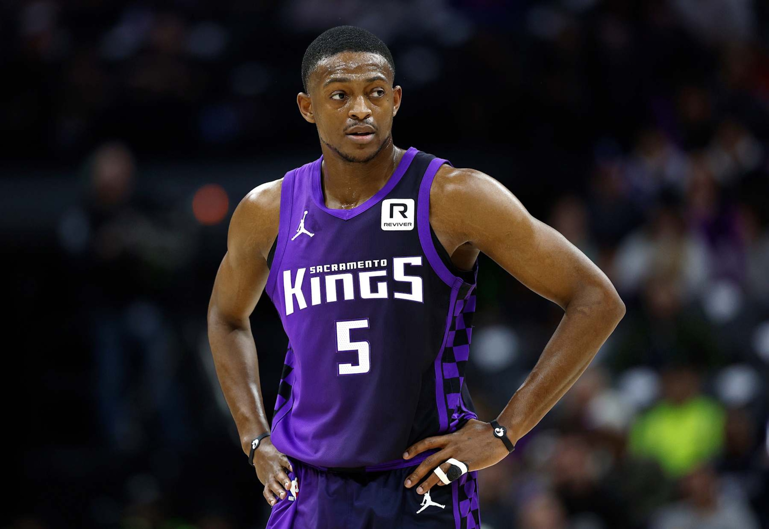 SACRAMENTO, CALIFORNIA - JANUARY 01: De'Aaron Fox #5 of the Sacramento Kings looks on against the Philadelphia 76ers during the first half of an NBA basketball game at Golden 1 Center on January 01, 2025 in Sacramento, California. NOTE TO USER: User expressly acknowledges and agrees that, by downloading and or using this photograph, User is consenting to the terms and conditions of the Getty Images License Agreement. (Photo by Thearon W. Henderson/Getty Images) SACRAMENTO, CALIFORNIA - JANUARY 01: De'Aaron Fox #5 of the Sacramento Kings looks on against the Philadelphia 76ers during the first half of an NBA basketball game at Golden 1 Center on January 01, 2025 in Sacramento, California. NOTE TO USER: User expressly acknowledges and agrees that, by downloading and or using this photograph, User is consenting to the terms and conditions of the Getty Images License Agreement. (Photo by Thearon W. Henderson/Getty Images)