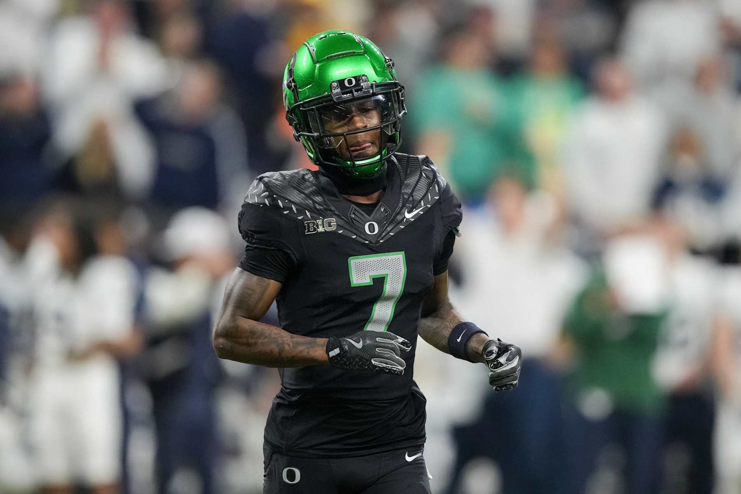INDIANAPOLIS, INDIANA - DECEMBER 07: Evan Stewart #7 of the Oregon Ducks lines up for a play in the second quarter against the Penn State Nittany Lions of the 2024 Big Ten Football Championship at Lucas Oil Stadium on December 07, 2024 in Indianapolis, Indiana. (Photo by Dylan Buell/Getty Images)