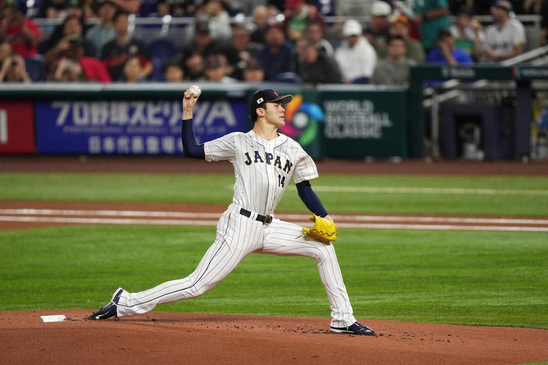 MIAMI, FL - MARCH 20: Roki Sasaki #14 of Japan delivers a pitch in the first inning against Mexico at loanDepot park on March 20, 2023 in Miami, Florida. (Photo by Jasen Vinlove/Miami Marlins/Getty Images)