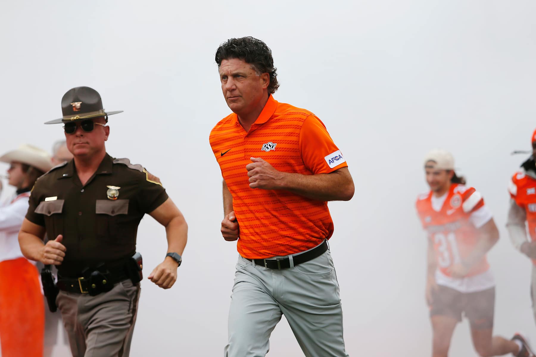 STILLWATER, OK - AUGUST 31: Head coach Mike Gundy of the Oklahoma State Cowboys runs onto the field for a game against the South Dakota State Jackrabbits at Boone Pickens Stadium on August 31, 2024 in Stillwater, Oklahoma. Oklahoma State won 44-20. (Photo by Brian Bahr/Getty Images)
