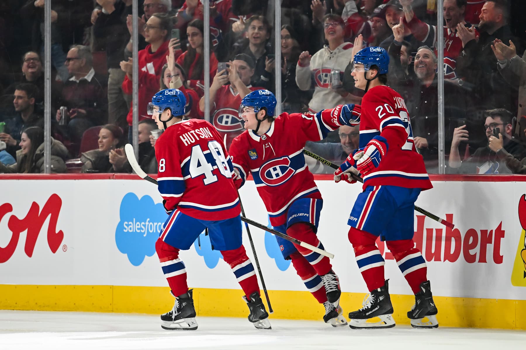 MONTREAL, CANADA - JANUARY 06: Cole Caufield #13 of the Montreal Canadiens celebrates his goal with teammates Lane Hutson #48 and Juraj Slafkovsky #20 during the first period against the Vancouver Canucks at the Bell Centre on January 6, 2025 in Montreal, Quebec, Canada. (Photo by Minas Panagiotakis/Getty Images)