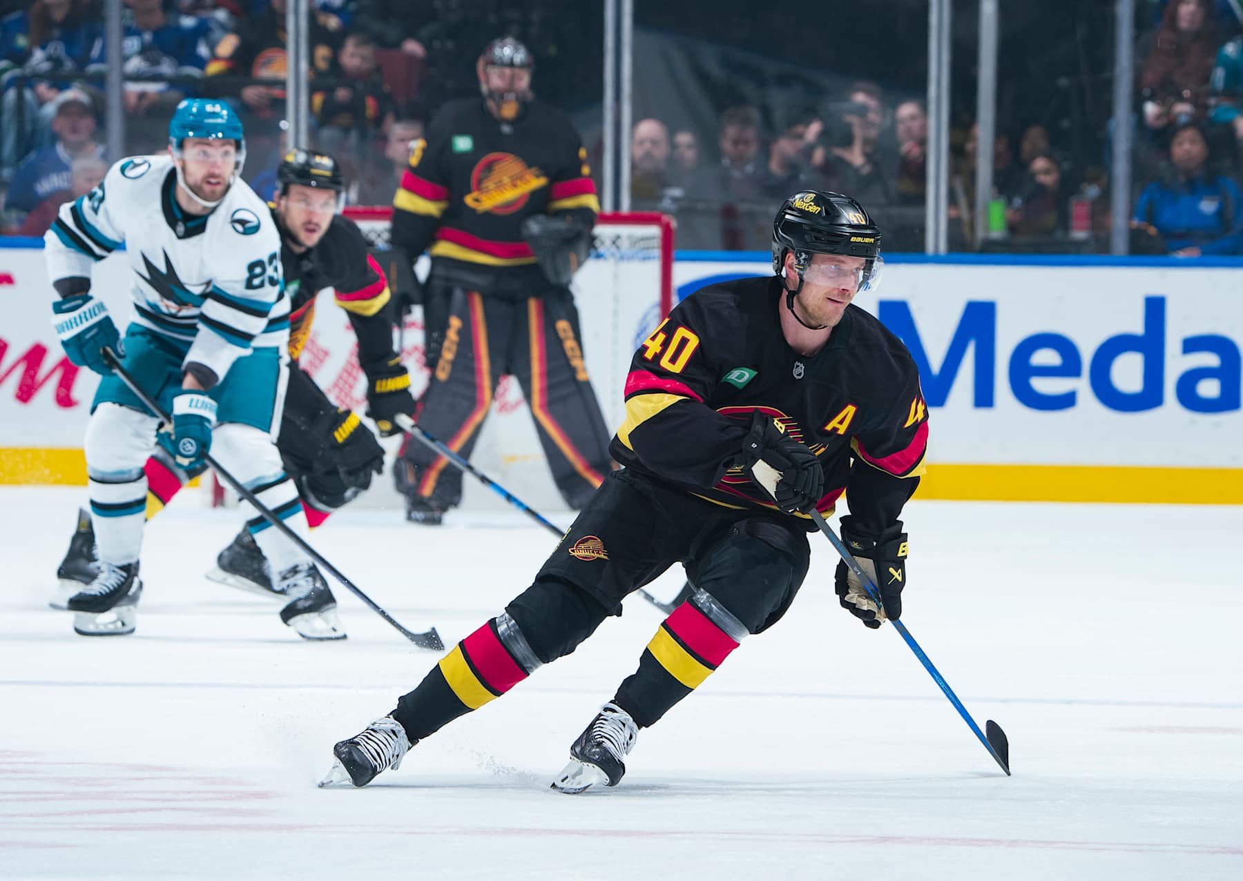 VANCOUVER, CANADA - DECEMBER 23: Elias Pettersson #40 of the Vancouver Canucks skates up ice during their NHL game against the San Jose Sharks at Rogers Arena on December 23, 2024 in Vancouver, British Columbia, Canada.  (Photo by Jeff Vinnick/NHLI via Getty Images)