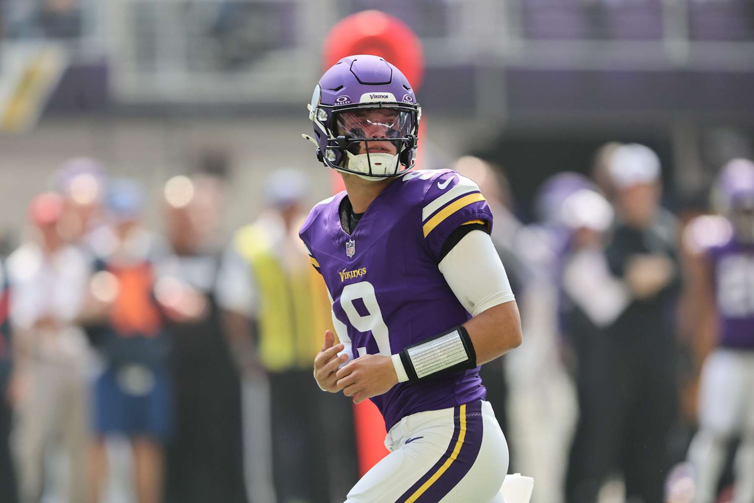 MINNEAPOLIS, MINNESOTA - AUGUST 10: J.J. McCarthy #9 of the Minnesota Vikings on the field during the pre-season game against Las Vegas Raiders in the first quarter at U.S. Bank Stadium on August 10, 2024 in Minneapolis, Minnesota. J.J. McCarthys season was cut short due to a knee injury in the preseason game. (Photo by Adam Bettcher/Getty Images)