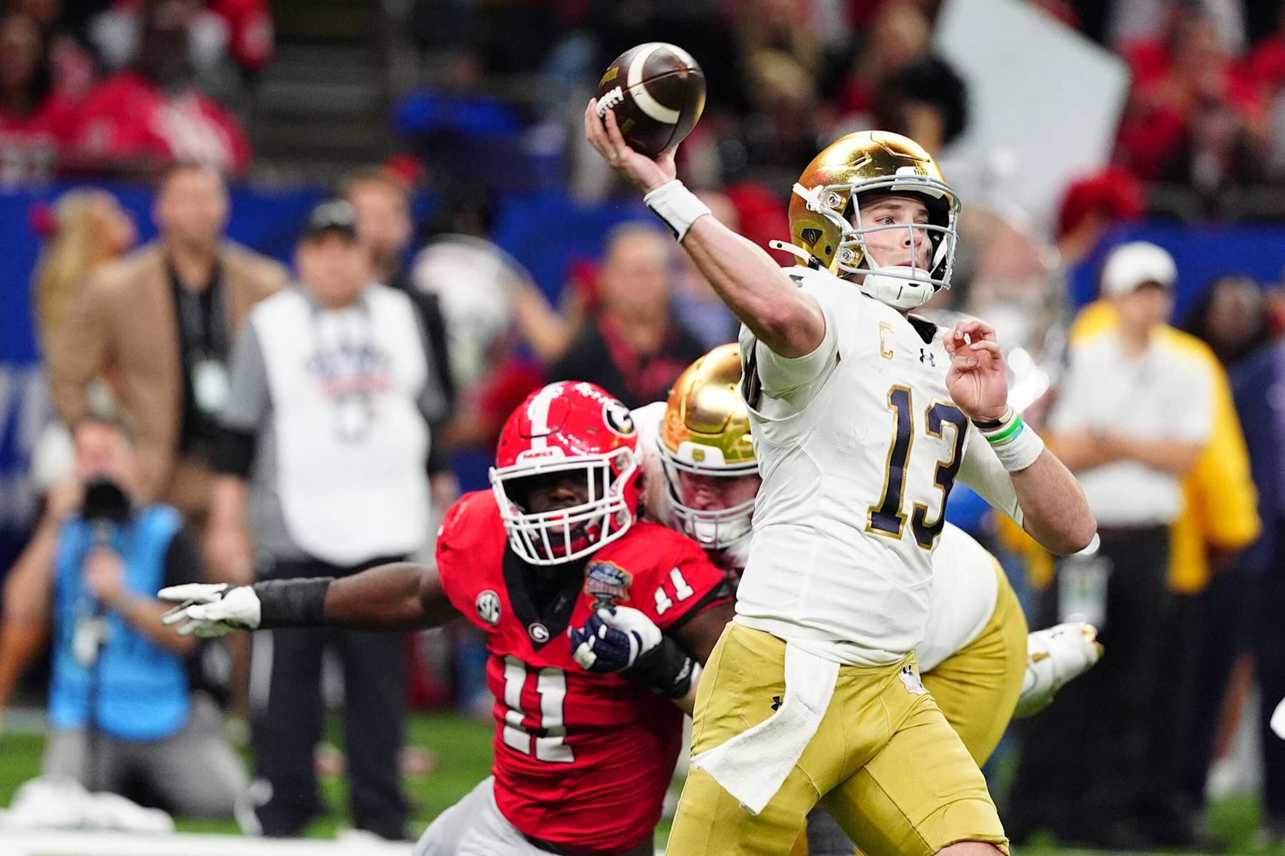 NEW ORLEANS, LA - JANUARY 02: Quarterback Riley Leonard #13 of the Notre Dame Fighting Irish throws a pass during the Notre Dame Fighting Irish versus the Georgia Bulldogs College Football Playoff Quarterfinal at the Allstate Sugar Bowl at the Caesars Superdome in New Orleans, Louisiana. (Photo by Brian Spurlock/Icon Sportswire via Getty Images) NEW ORLEANS, LA - JANUARY 02: Quarterback Riley Leonard #13 of the Notre Dame Fighting Irish throws a pass during the Notre Dame Fighting Irish versus the Georgia Bulldogs College Football Playoff Quarterfinal at the Allstate Sugar Bowl at the Caesars Superdome in New Orleans, Louisiana. (Photo by Brian Spurlock/Icon Sportswire via Getty Images)