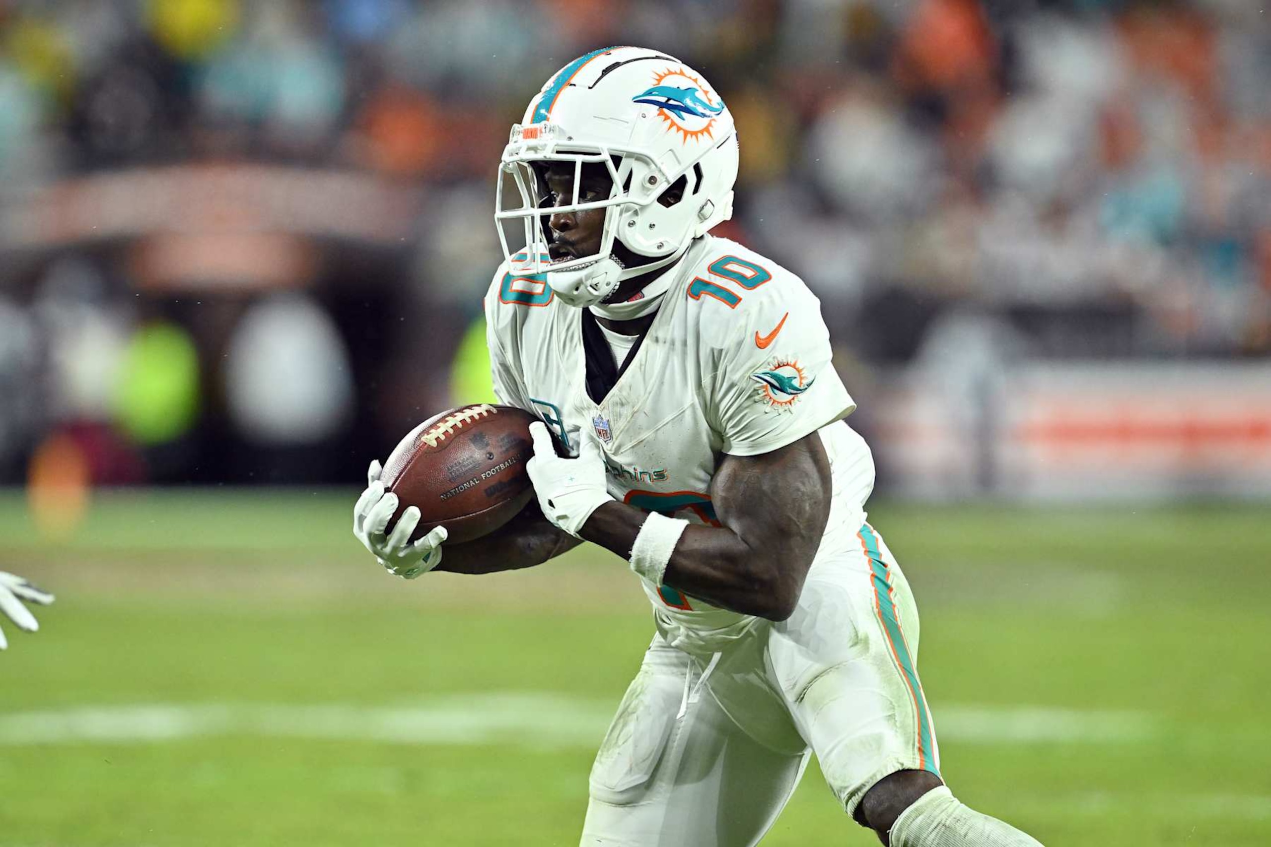 CLEVELAND, OHIO - DECEMBER 29: Wide receiver Tyreek Hill #10 of the Miami Dolphins runs for a gain during the fourth quarter against the Cleveland Browns at Huntington Bank Field on December 29, 2024 in Cleveland, Ohio. The Dolphins defeated the Browns 20-3. (Photo by Jason Miller/Getty Images)