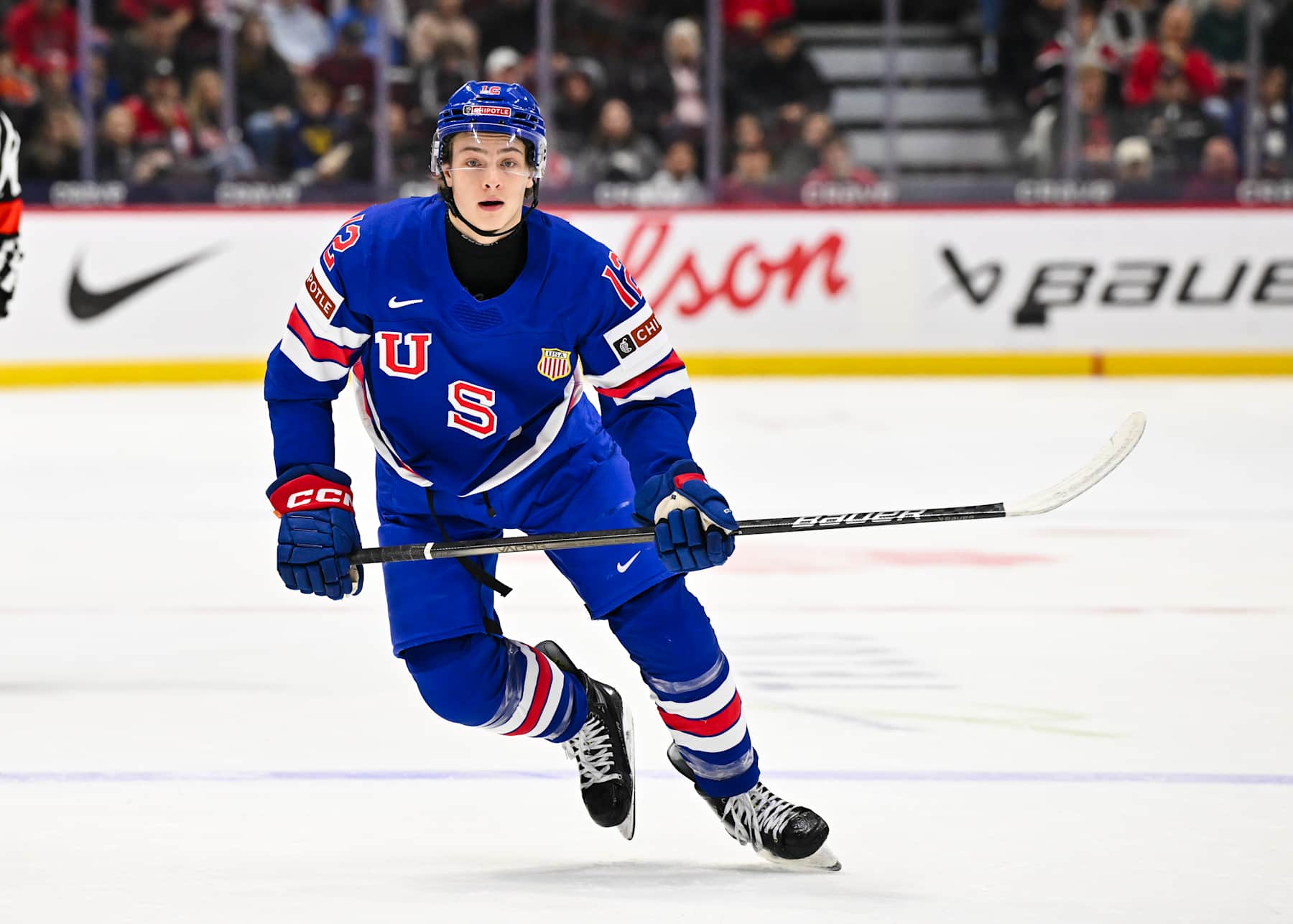OTTAWA, CANADA - JANUARY 02:  James Hagens #12 of Team USA skates in the first period against Team Switzerland of the quarterfinals match during the 2025 IIHF World Junior Championship at Canadian Tire Centre on January 2, 2025 in Ottawa, Ontario, Canada.  Team USA defeated Team Switzerland 7-2.  (Photo by Minas Panagiotakis/Getty Images)
