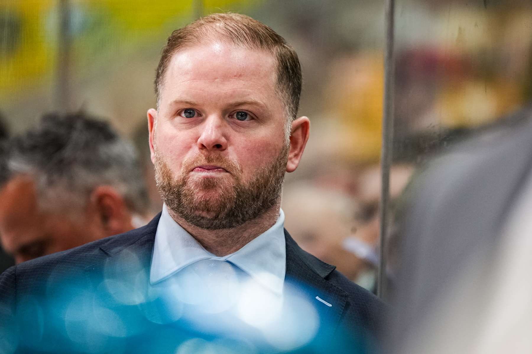 RALEIGH, NORTH CAROLINA - DECEMBER 10: Head coach Ryan Warsofsky of the San Jose Sharks looks on during the second period of the game against the Carolina Hurricanes at Lenovo Center on December 10, 2024 in Raleigh, North Carolina.  (Photo by Josh Lavallee/NHLI via Getty Images)