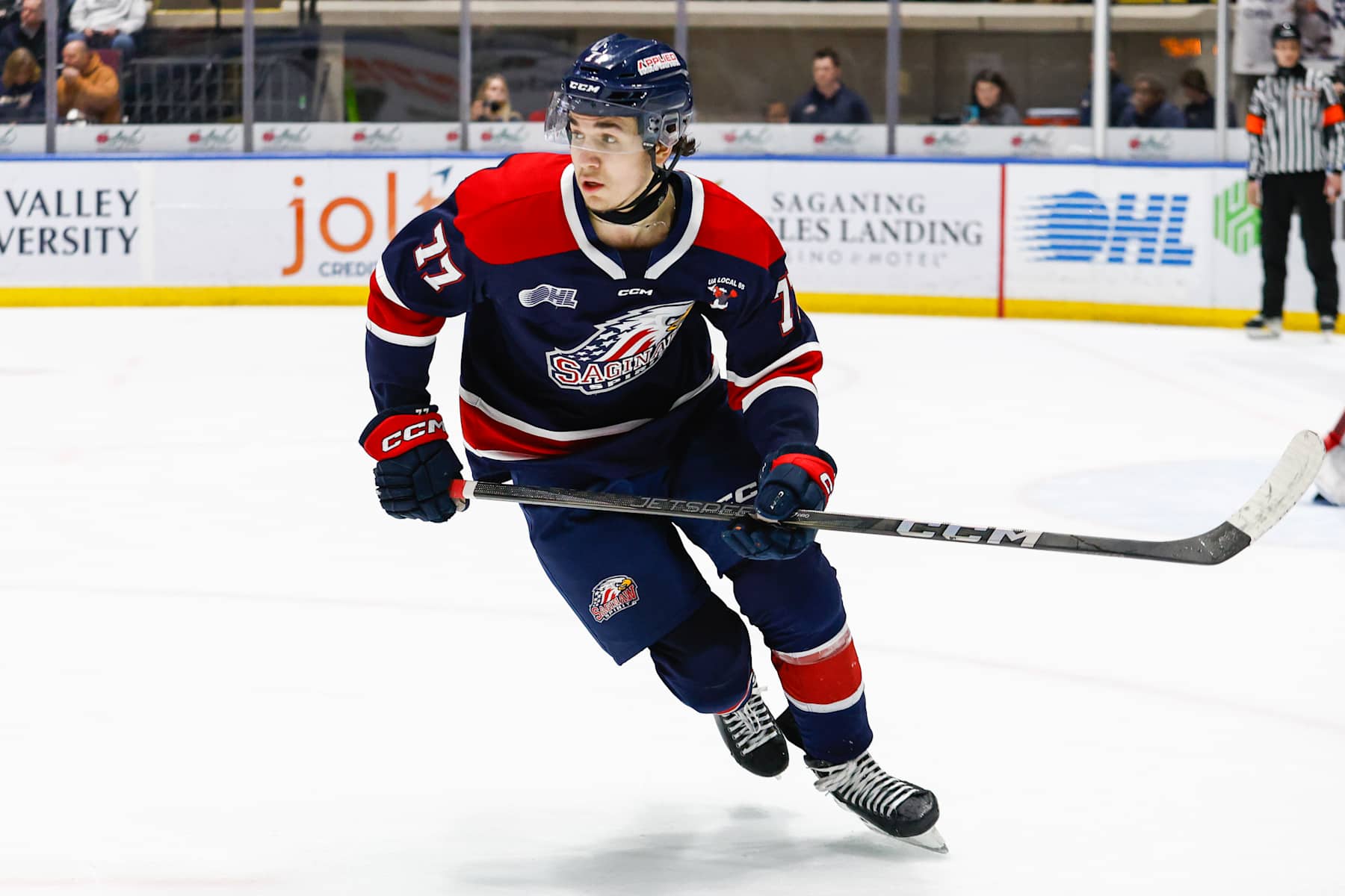 SAGINAW, MI - DECEMBER 29: Michael Misa #77 of Saginaw skates for the puck during a game between Niagara Ice Dogs and Saginaw Spirit at Dow Event Center on December 29, 2024 in Saginaw, Michigan. (Photo by Michael Miller/ISI Photos/Getty Images)