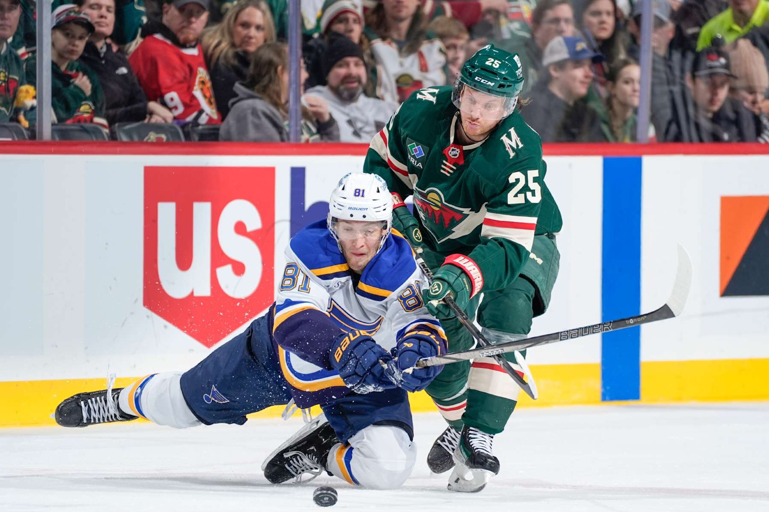 SAINT PAUL, MN - JANUARY 7: Dylan Holloway #81 of the St. Louis Blues and Jonas Brodin #25 of the Minnesota Wild battle for the puck during the game at the Xcel Energy Center on January 7, 2025 in Saint Paul, Minnesota. (Photo by Bruce Kluckhohn/NHLI via Getty Images) SAINT PAUL, MN - JANUARY 7: Dylan Holloway #81 of the St. Louis Blues and Jonas Brodin #25 of the Minnesota Wild battle for the puck during the game at the Xcel Energy Center on January 7, 2025 in Saint Paul, Minnesota. (Photo by Bruce Kluckhohn/NHLI via Getty Images)