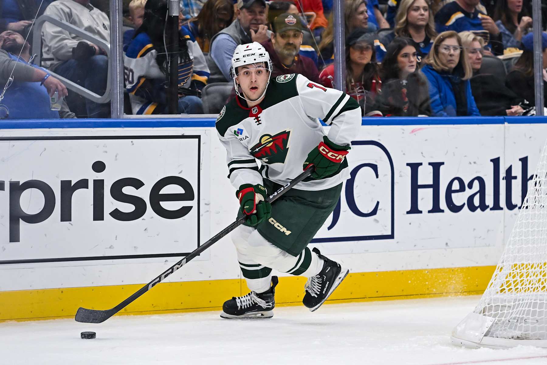 ST. LOUIS, MO - NOVEMBER 19: Minnesota Wild defenseman Brock Faber (7) skates with the puck during a regular season game where the St. Louis Blues hosted the Minnesota Wild on Tuesday November 19, 2024, at the Enterprise Center in St. Louis MO (Photo by Rick Ulreich/Icon Sportswire via Getty Images)
