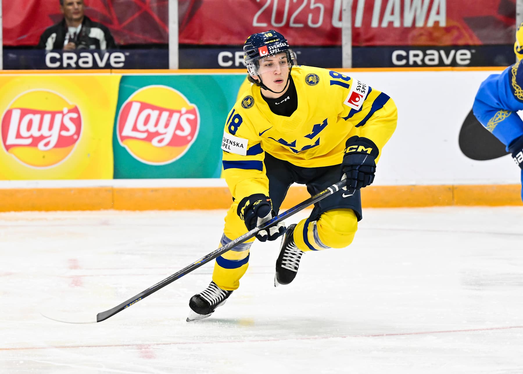 OTTAWA, CANADA - DECEMBER 27:  Victor Eklund #18 of Team Sweden skates in the second period against Team Kazakhstan of the Group B match during the 2025 IIHF World Junior Championship at The Arena at TD place on December 27, 2024 in Ottawa, Ontario, Canada.  Team Sweden defeated Team Kazakhstan 8-1.  (Photo by Minas Panagiotakis/Getty Images)