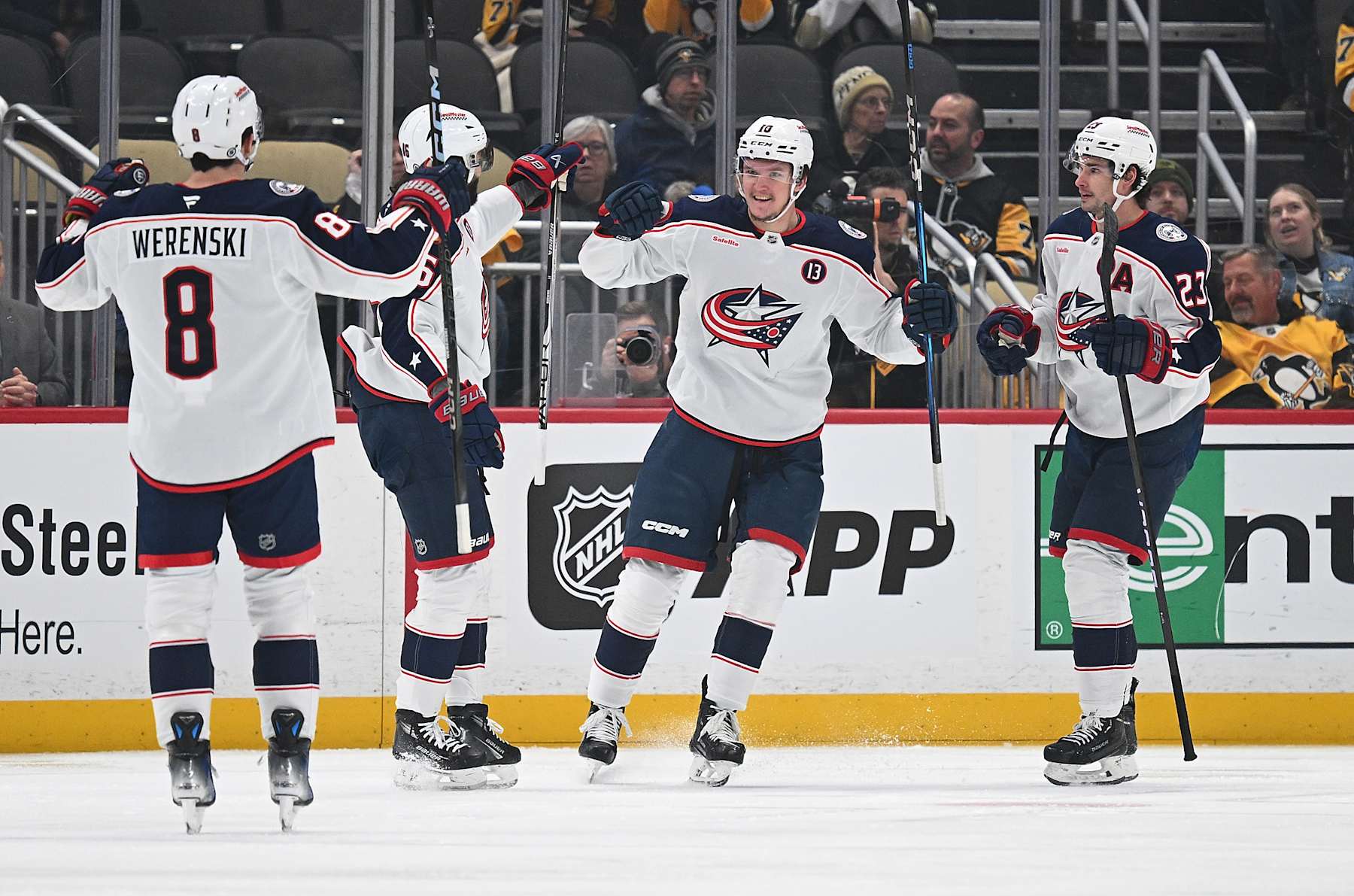 PITTSBURGH, PENNSYLVANIA - JANUARY 7: Dmitri Voronkov #10 of the Columbus Blue Jackets celebrates with teammates after scoring a goal in the first period during the game against the Pittsburgh Penguins at PPG PAINTS Arena on January 7, 2025 in Pittsburgh, Pennsylvania. (Photo by Justin Berl/Getty Images)