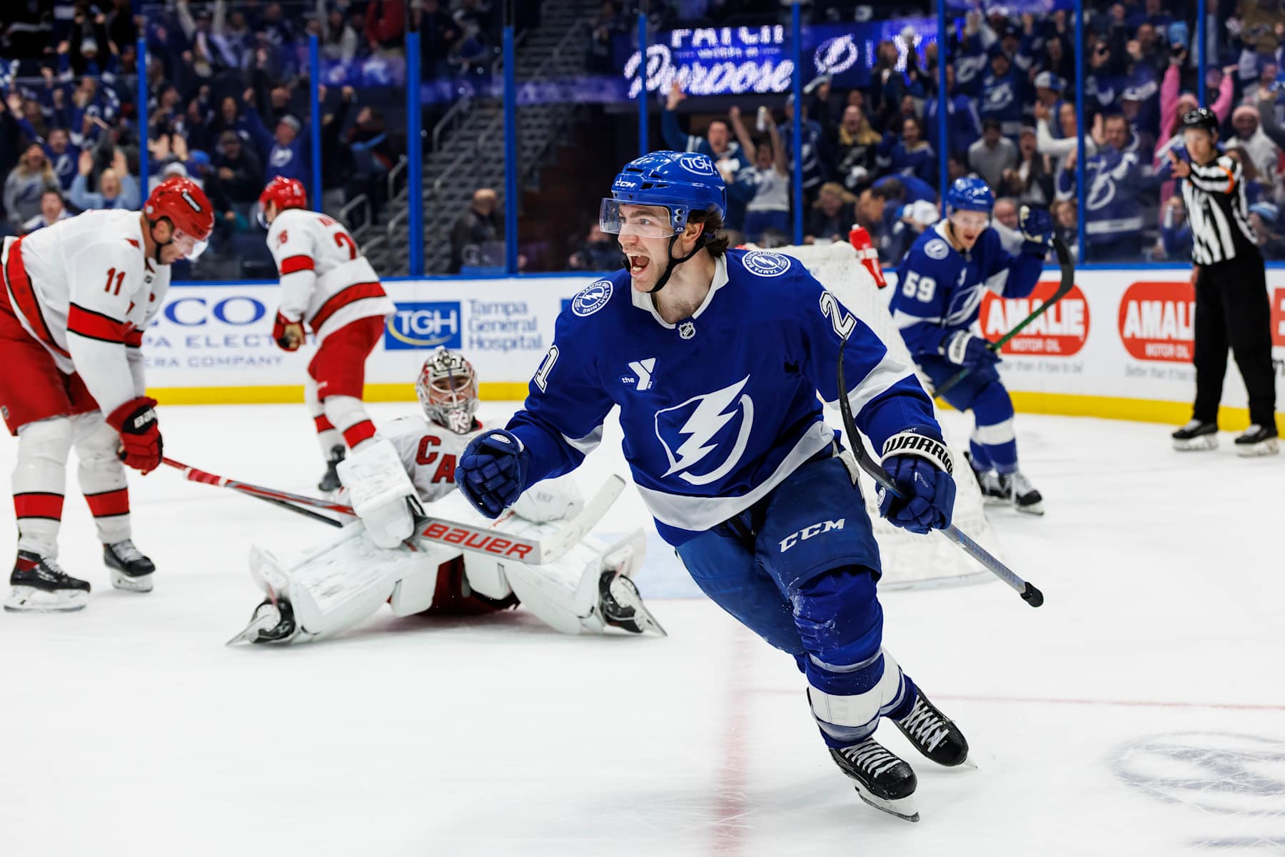 TAMPA, FL - JANUARY 7: Brayden Point #21 of the Tampa Bay Lightning celebrates the game winning goal against the Carolina Hurricanes at Amalie Arena on January 7, 2025 in Tampa, Florida. (Photo by Mark LoMoglio/NHLI via Getty Images)