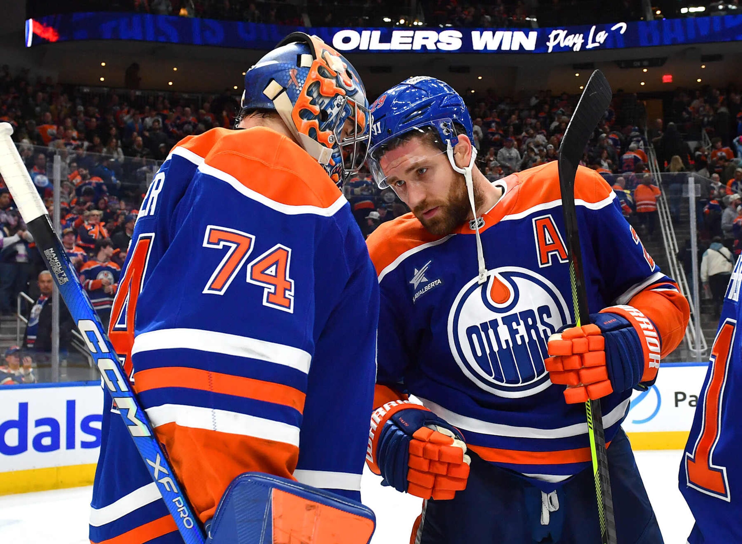 EDMONTON, CANADA - DECEMBER 31: Leon Draisaitl #29 and Stuart Skinner #74 of the Edmonton Oilers celebrate a victory over the Utah Hockey Club after the game at Rogers Place on December 31, 2024, in Edmonton, Alberta, Canada. (Photo by Andy Devlin/NHLI via Getty Images) EDMONTON, CANADA - DECEMBER 31: Leon Draisaitl #29 and Stuart Skinner #74 of the Edmonton Oilers celebrate a victory over the Utah Hockey Club after the game at Rogers Place on December 31, 2024, in Edmonton, Alberta, Canada. (Photo by Andy Devlin/NHLI via Getty Images)