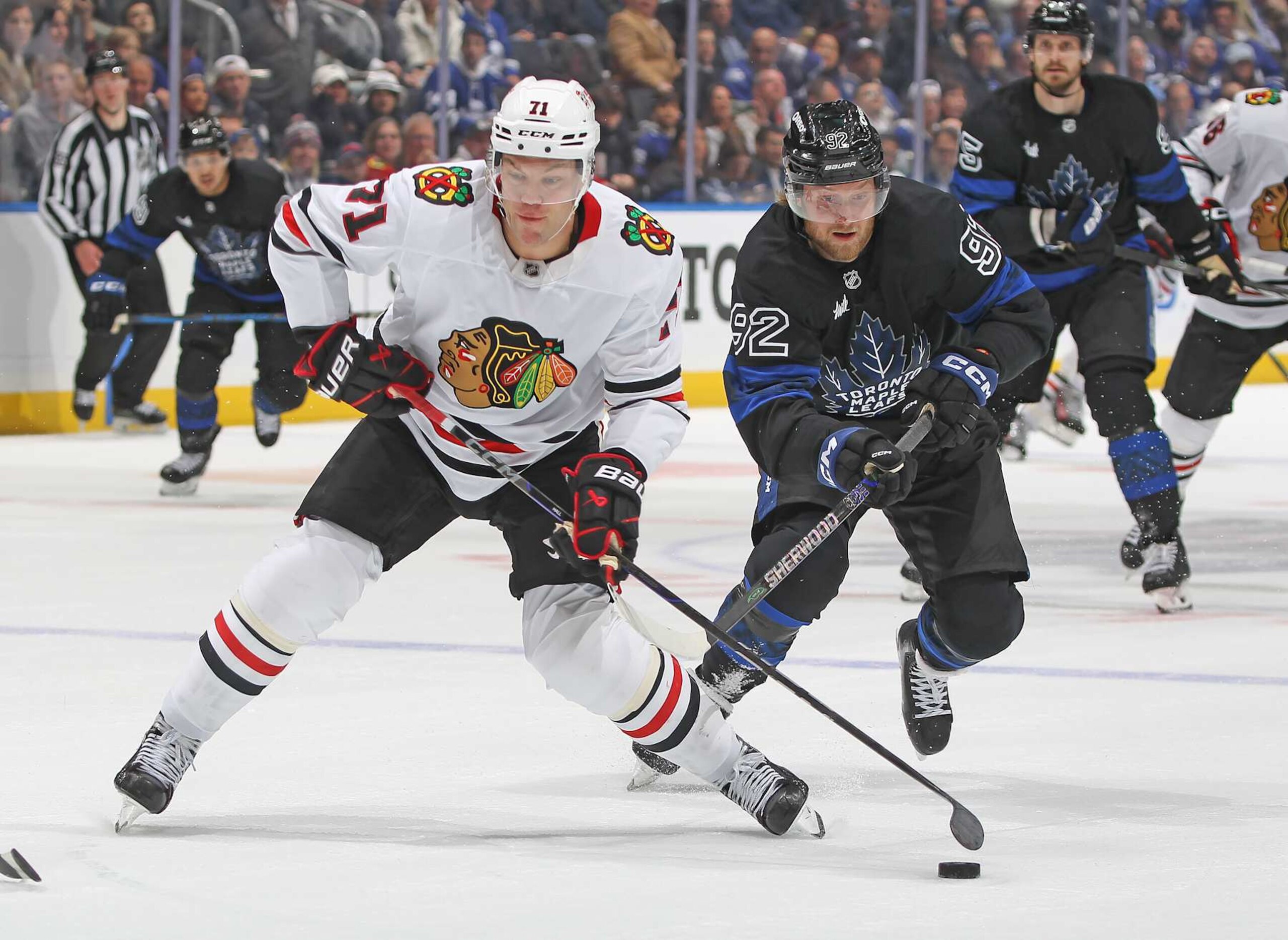 TORONTO, CANADA - DECEMBER 2: Taylor Hall #71 of the Chicago Blackhawks draws a penalty on Alexander Nylander #92 of the Toronto Maple Leafs during the third period of an NHL game at Scotiabank Arena on December 2, 2024 in Toronto, Ontario, Canada. Alexander Nylander was called for a hooking penalty on the play. The Maple Leafs defeated the Blackhawks 4-1. (Photo by Claus Andersen/Getty Images) TORONTO, CANADA - DECEMBER 2: Taylor Hall #71 of the Chicago Blackhawks draws a penalty on Alexander Nylander #92 of the Toronto Maple Leafs during the third period of an NHL game at Scotiabank Arena on December 2, 2024 in Toronto, Ontario, Canada. Alexander Nylander was called for a hooking penalty on the play. The Maple Leafs defeated the Blackhawks 4-1. (Photo by Claus Andersen/Getty Images)