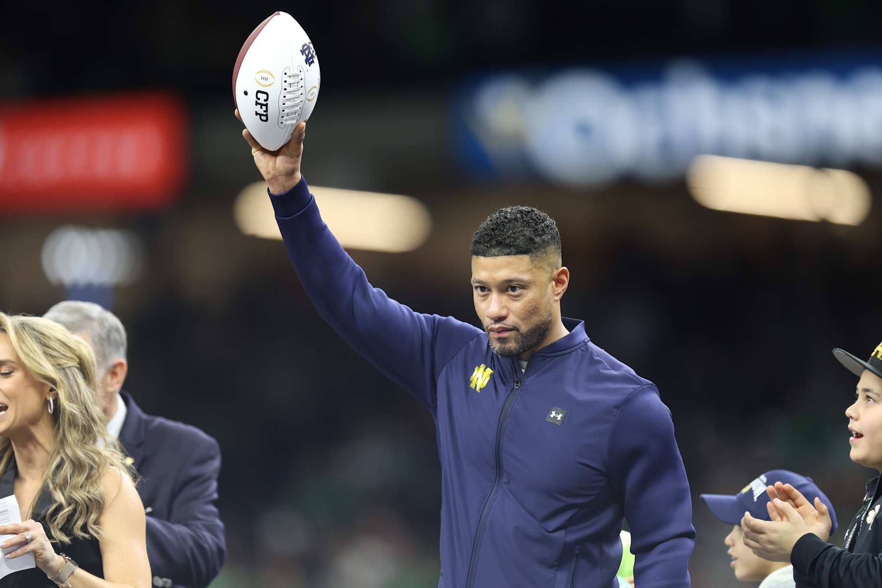 NEW ORLEANS, LOUISIANA - JANUARY 2: head coach Marcus Freeman of the Notre Dame Fighting Irish receives the ball hand off after the game between the Georgia Bulldogs and the Notre Dame Fighting Irish at Caesars Superdome on January 2, 2025 in New Orleans, Louisiana. (Photo by CFP/Getty Images)
