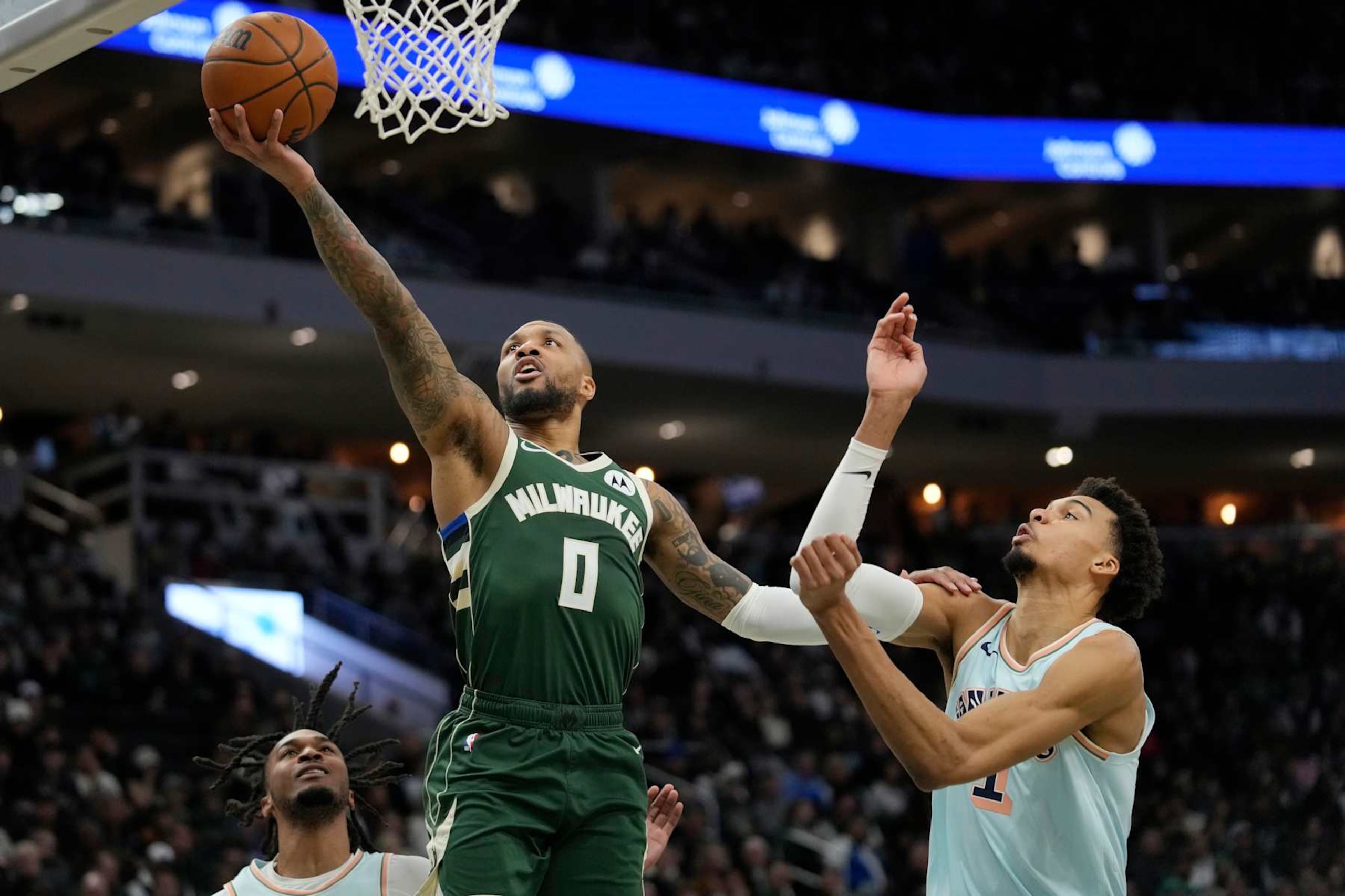 MILWAUKEE, WISCONSIN - JANUARY 08: Damian Lillard #0 of the Milwaukee Bucks shoots the ball against Victor Wembanyama #1 of the San Antonio Spurs during the second quarter at Fiserv Forum on January 08, 2025 in Milwaukee, Wisconsin. NOTE TO USER: User expressly acknowledges and agrees that, by downloading and or using this photograph, User is consenting to the terms and conditions of the Getty Images License Agreement. (Photo by Patrick McDermott/Getty Images) MILWAUKEE, WISCONSIN - JANUARY 08: Damian Lillard #0 of the Milwaukee Bucks shoots the ball against Victor Wembanyama #1 of the San Antonio Spurs during the second quarter at Fiserv Forum on January 08, 2025 in Milwaukee, Wisconsin. NOTE TO USER: User expressly acknowledges and agrees that, by downloading and or using this photograph, User is consenting to the terms and conditions of the Getty Images License Agreement. (Photo by Patrick McDermott/Getty Images)