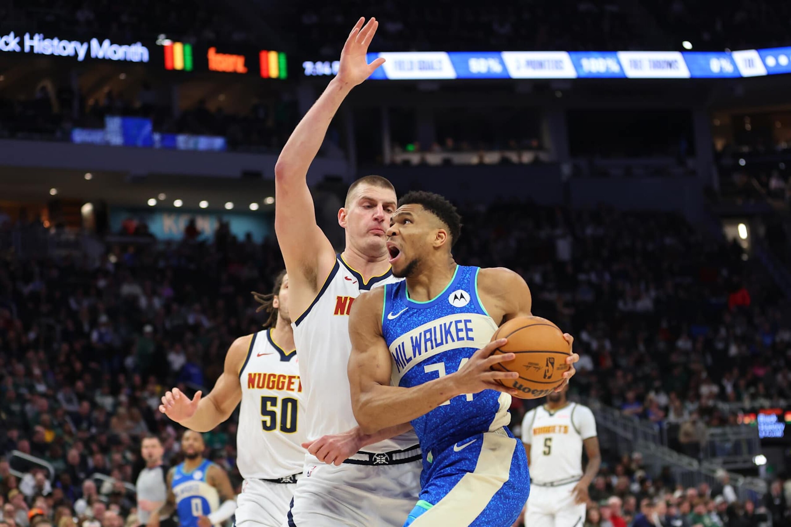 MILWAUKEE, WISCONSIN - FEBRUARY 12: Giannis Antetokounmpo #34 of the Milwaukee Bucks is defended by Nikola Jokic #15 of the Denver Nuggets during a game at Fiserv Forum on February 12, 2024 in Milwaukee, Wisconsin. NOTE TO USER: User expressly acknowledges and agrees that, by downloading and or using this photograph, User is consenting to the terms and conditions of the Getty Images License Agreement. (Photo by Stacy Revere/Getty Images) MILWAUKEE, WISCONSIN - FEBRUARY 12: Giannis Antetokounmpo #34 of the Milwaukee Bucks is defended by Nikola Jokic #15 of the Denver Nuggets during a game at Fiserv Forum on February 12, 2024 in Milwaukee, Wisconsin. NOTE TO USER: User expressly acknowledges and agrees that, by downloading and or using this photograph, User is consenting to the terms and conditions of the Getty Images License Agreement. (Photo by Stacy Revere/Getty Images)