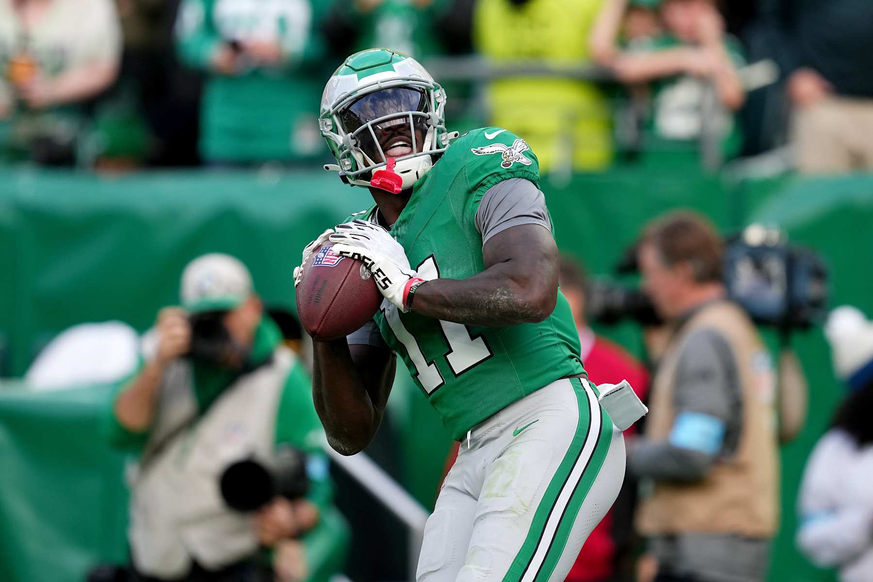 PHILADELPHIA, PENNSYLVANIA - DECEMBER 29: A.J. Brown #11 of the Philadelphia Eagles throws the ball in the stands after catching a touchdown against the Dallas Cowboys during the third quarter at Lincoln Financial Field on December 29, 2024 in Philadelphia, Pennsylvania. (Photo by Mitchell Leff/Getty Images)