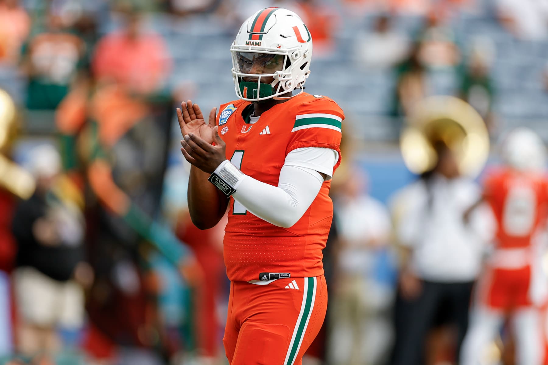 ORLANDO, FL - DECEMBER 28: Miami Hurricanes quarterback Cam Ward (1) looks on before the game between the Miami Hurricanes and the Iowa State Cyclones on December 28, 2024 at Camping World Stadium in Orlando, Fl. (Photo by David Rosenblum/Icon Sportswire via Getty Images)