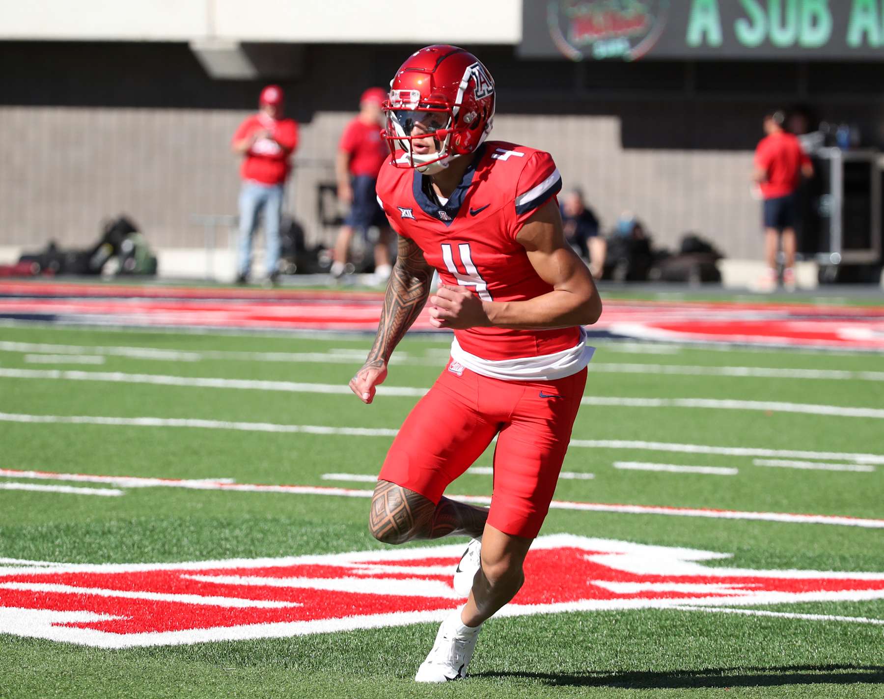 TUCSON, ARIZONA - NOVEMBER 30: Wide receiver Tetairoa McMillan #4 of the University of Arizona Wildcats runs some pregame drills before the University of Arizona Wildcats versus the Arizona State Sun Devils football game at Arizona Stadium on November 30, 2024 in Tucson, Arizona. (Photo by Bruce Yeung/Getty Images)