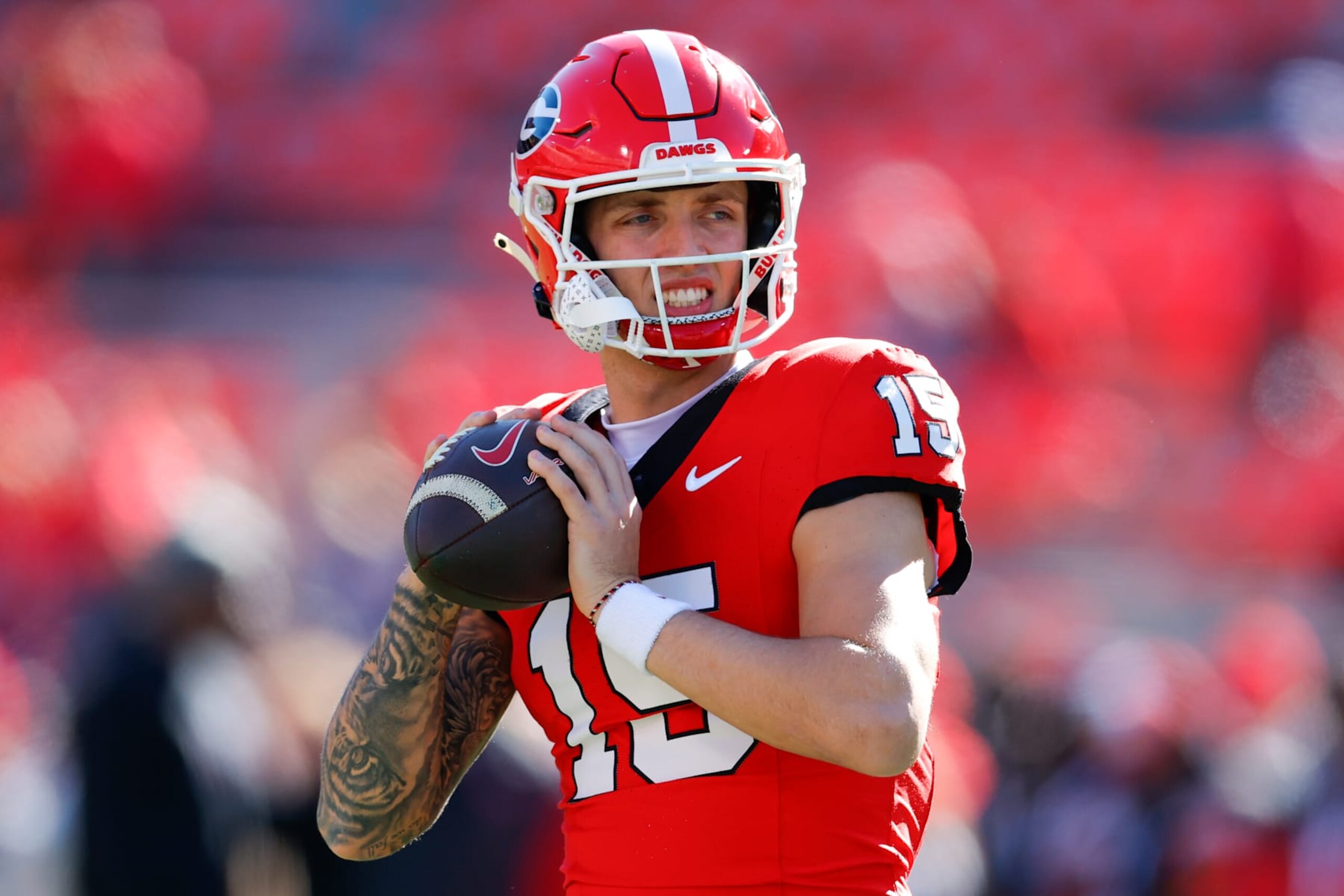 ATHENS, GEORGIA - NOVEMBER 23: Carson Beck #15 of the Georgia Bulldogs warms up prior to the game against the Massachusetts Minutemen at Sanford Stadium on November 23, 2024 in Athens, Georgia.  (Photo by Todd Kirkland/Getty Images)
