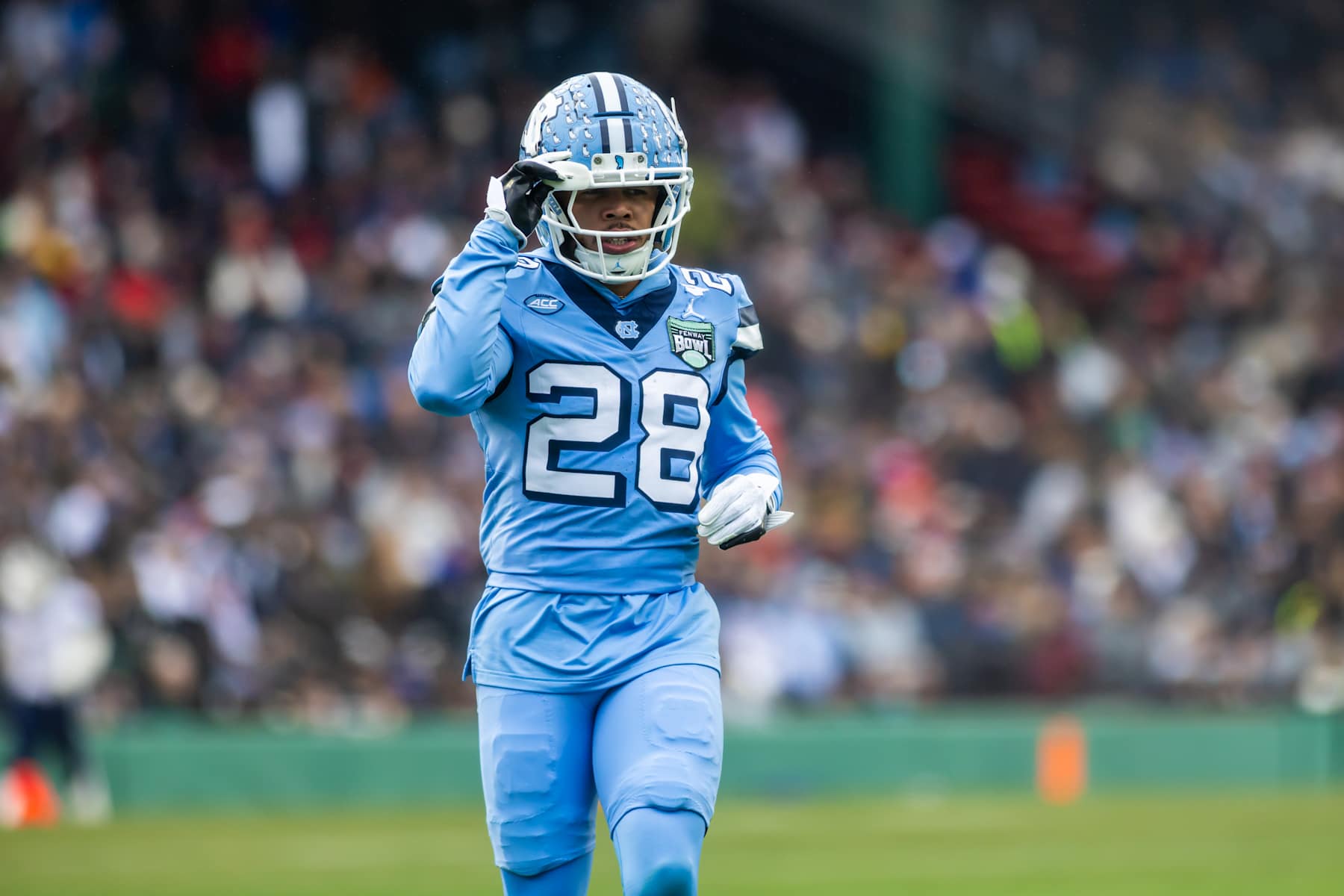 BOSTON, MA - DECEMBER 28: Omarion Hampton #28 of the North Carolina Tar Heels during the Wasabi Fenway Bowl between the North Carolina Tar Heels and the Connecticut Huskies at Fenway Park on December 28, 2024 in Boston, Massachusetts. (Photo by John McGloughlin/ISI Photos/Getty Images)