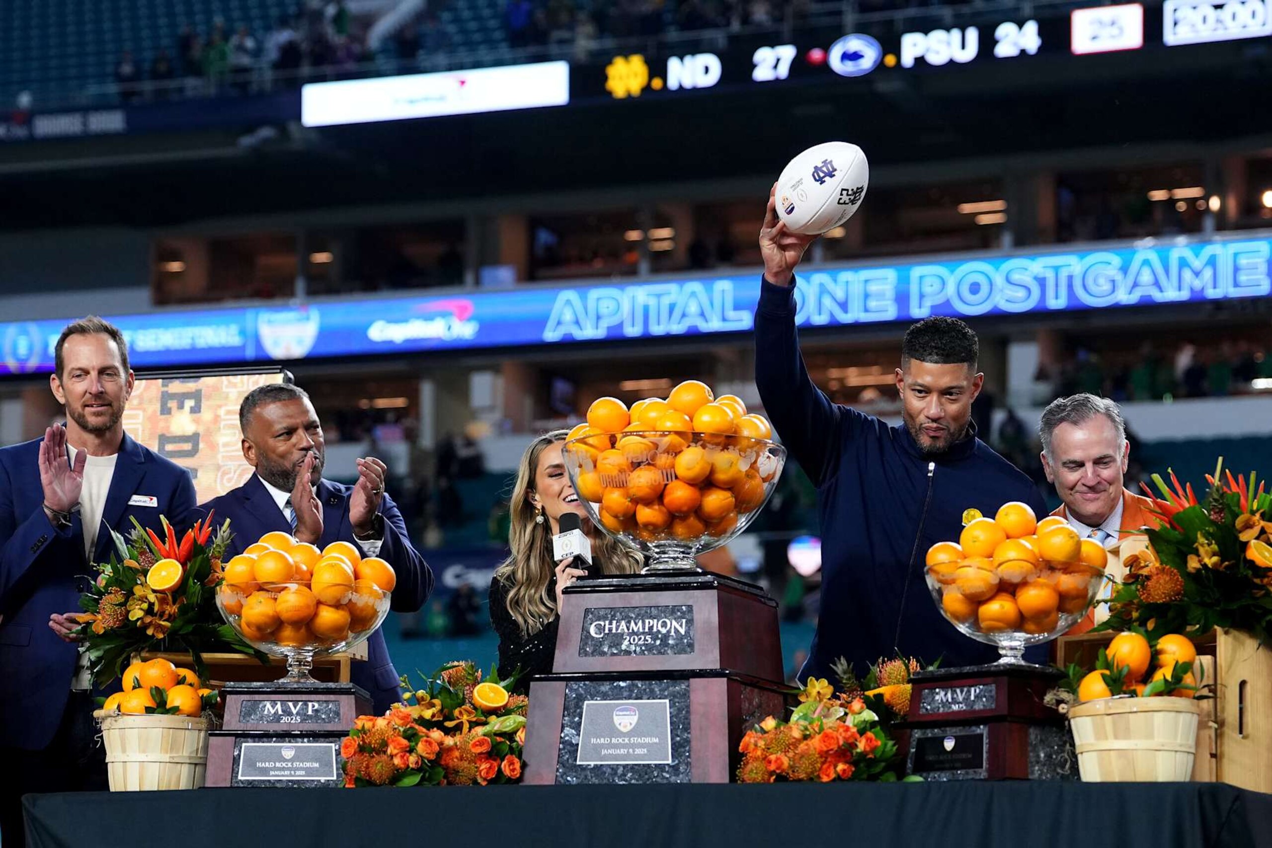 MIAMI GARDENS, FLORIDA - JANUARY 09: Head coach Marcus Freeman of the Notre Dame Fighting Irish raises a game ball after defeating the Penn State Nittany Lions 27-24 in the Capital One Orange Bowl at Hard Rock Stadium on January 09, 2025 in Miami Gardens, Florida. (Photo by Rich Storry/Getty Images)
